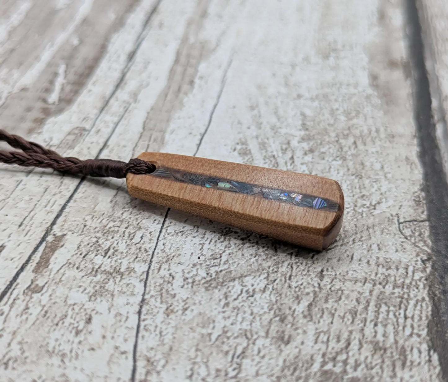 New Zealand swamp kauri roimata pendant with rainbow Pāua.