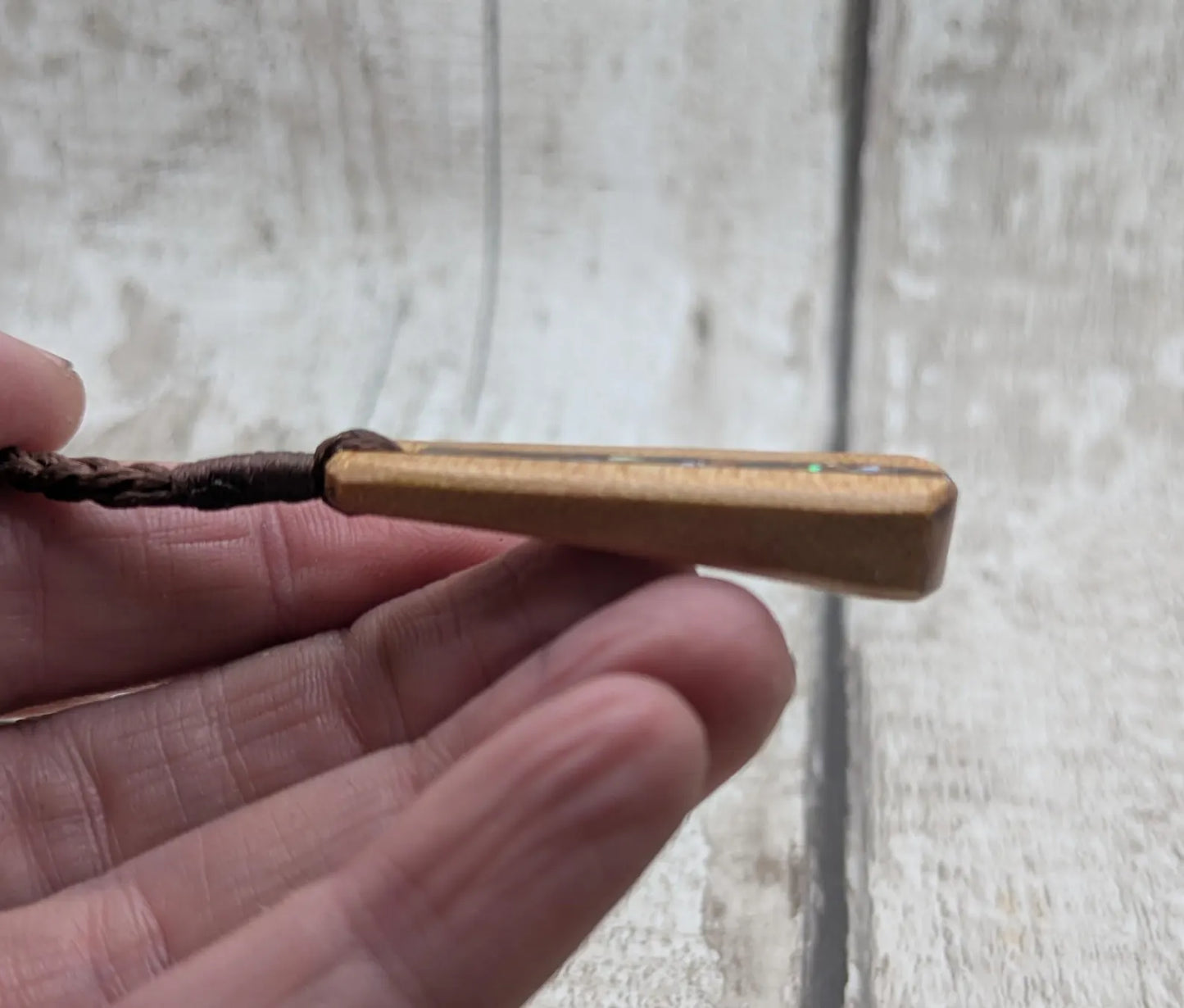 New Zealand swamp kauri roimata pendant with rainbow Pāua.