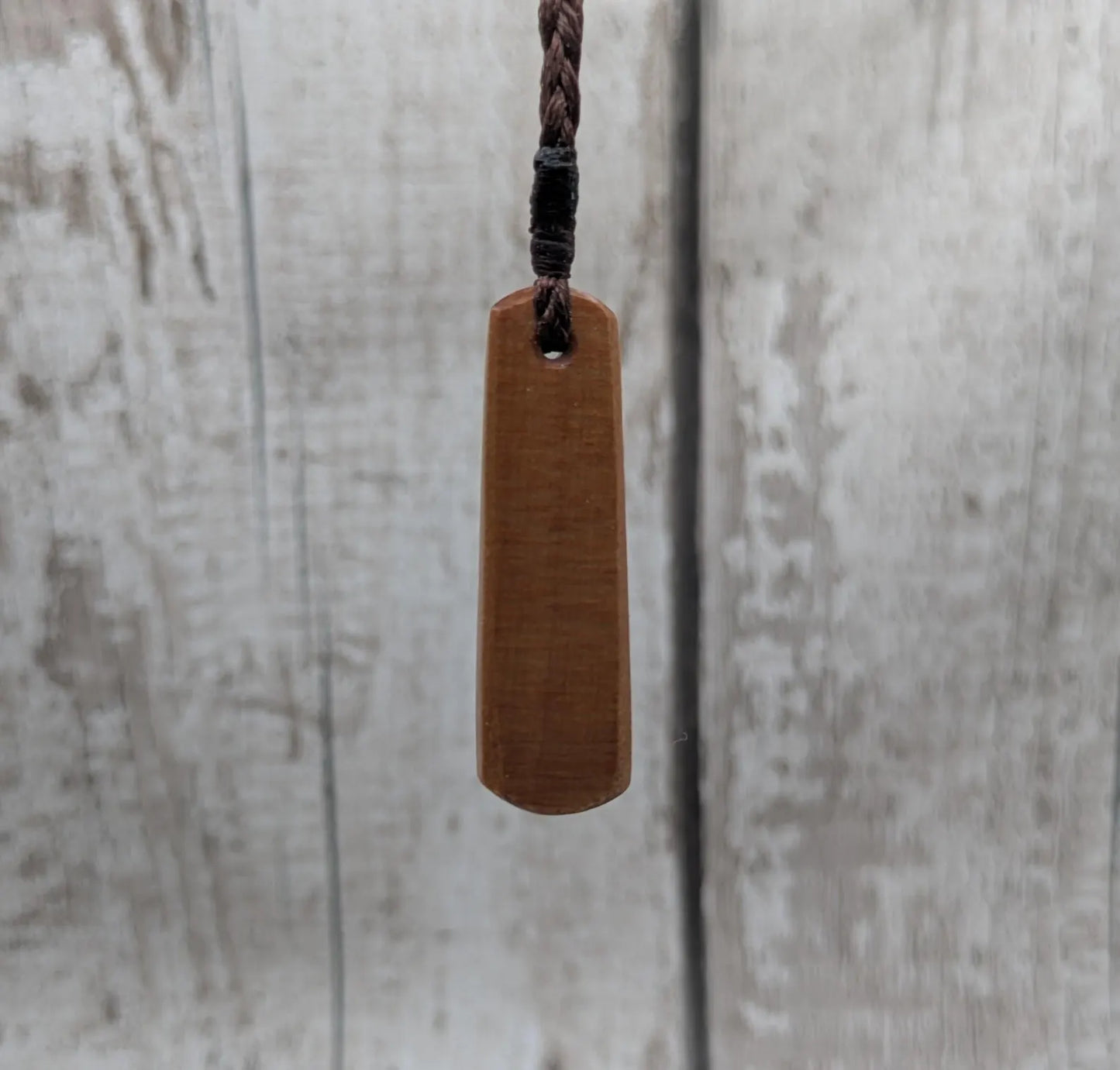 New Zealand swamp kauri roimata pendant with rainbow Pāua.