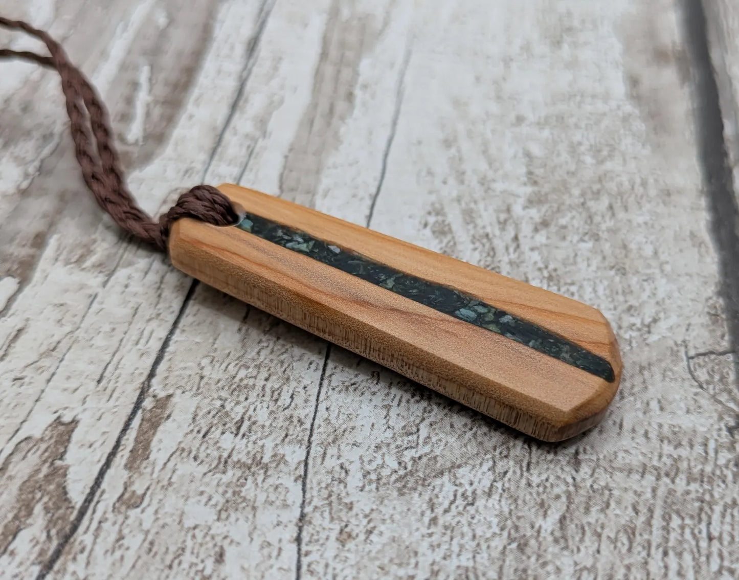 Made to order Yew wood toki style pendant with mixed pounamu greenstone inlay - Handcrafted British jewellery, Māori inspired nature talisman.