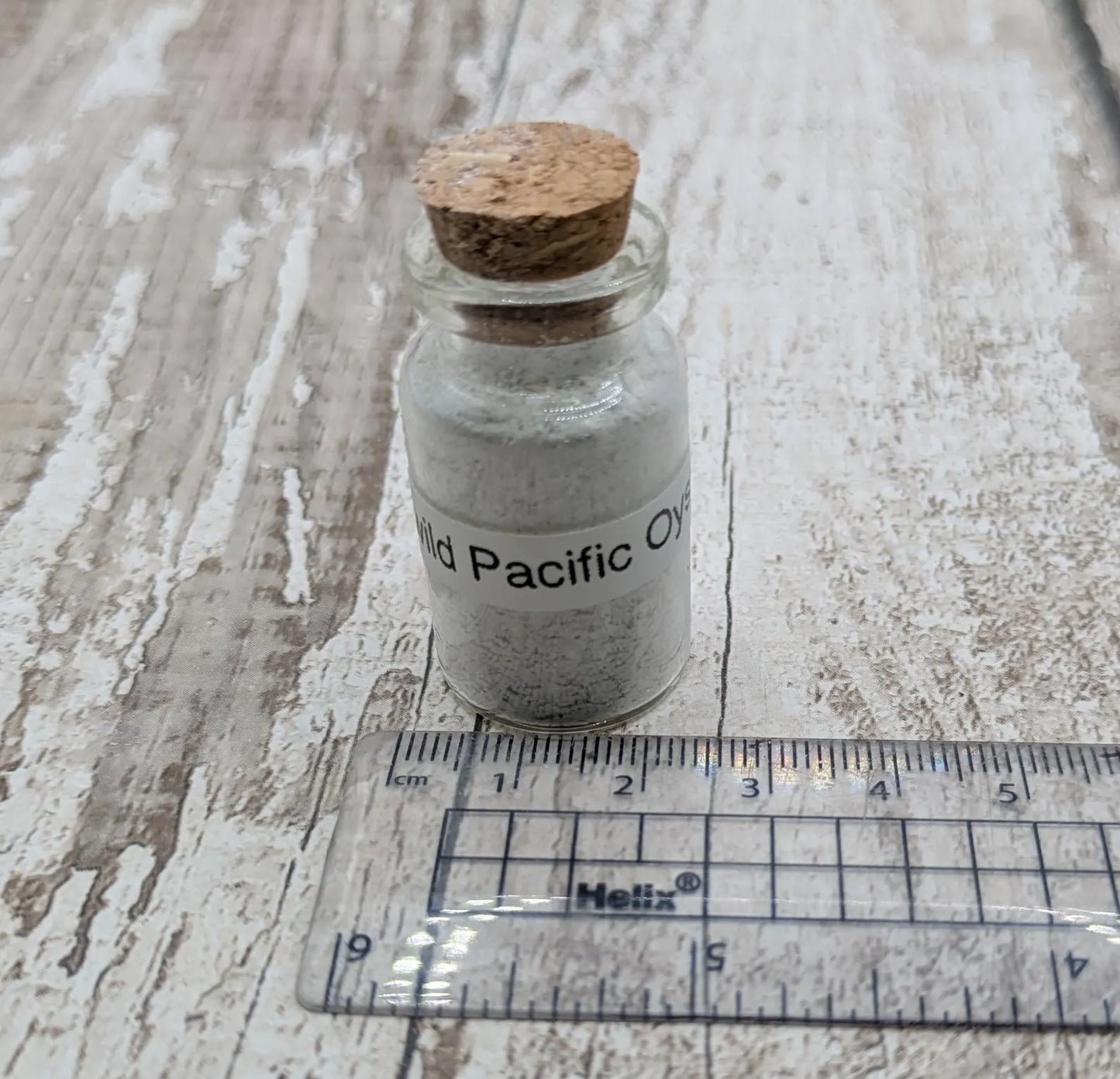 unrefined Pacific Oyster powder pigment with purple tint.