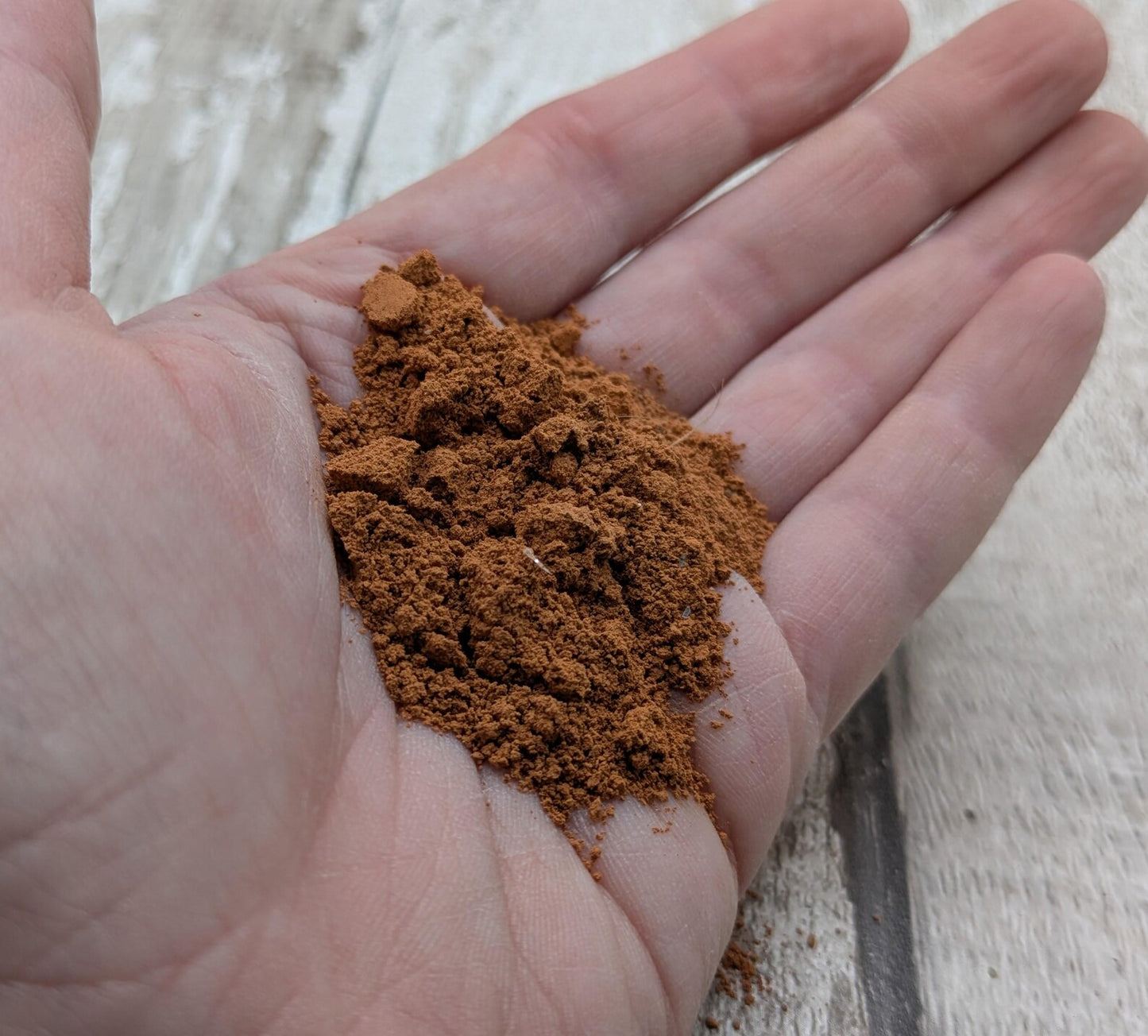 Unrefined powdered sea brick paint pigment.