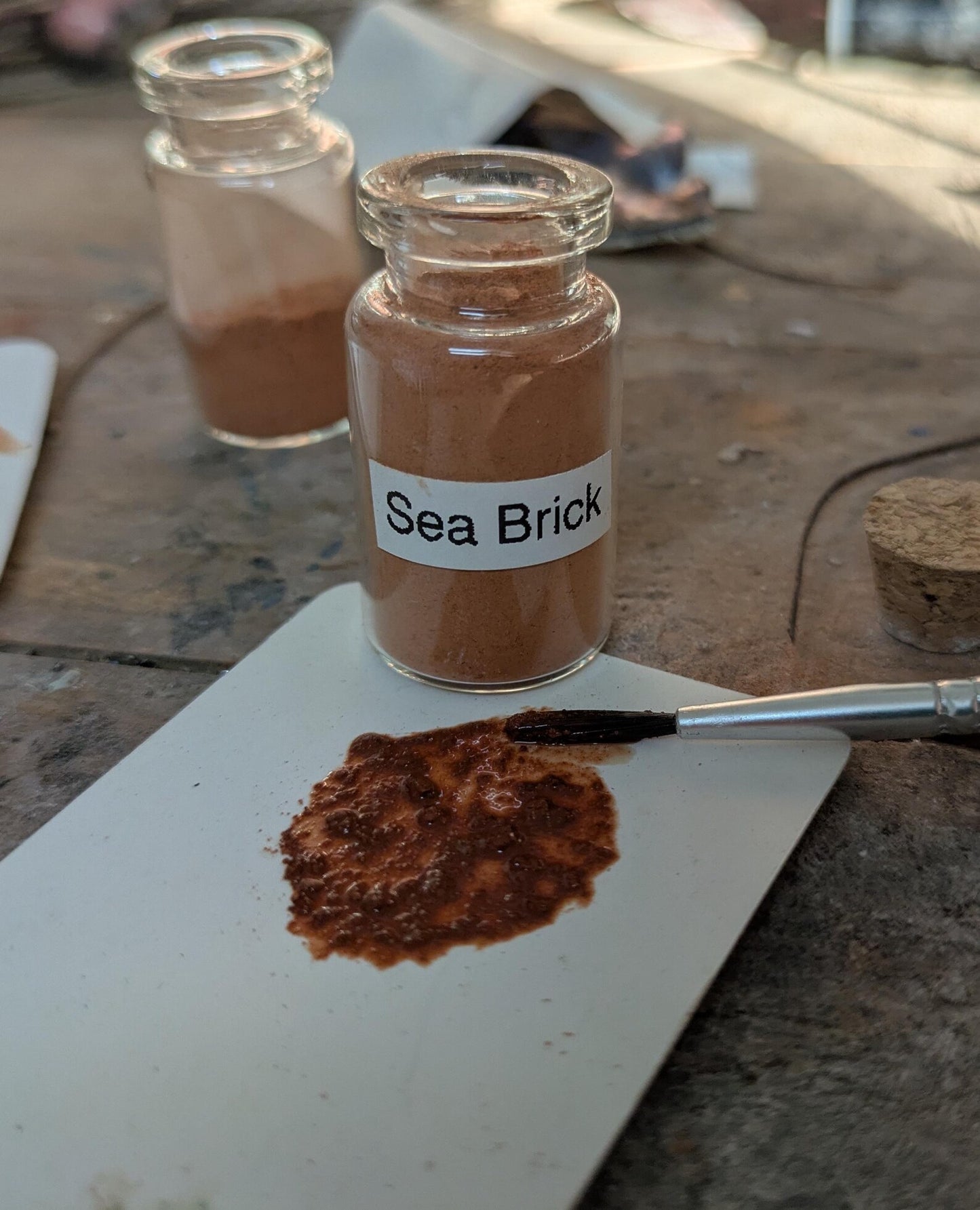 Unrefined powdered sea brick paint pigment.
