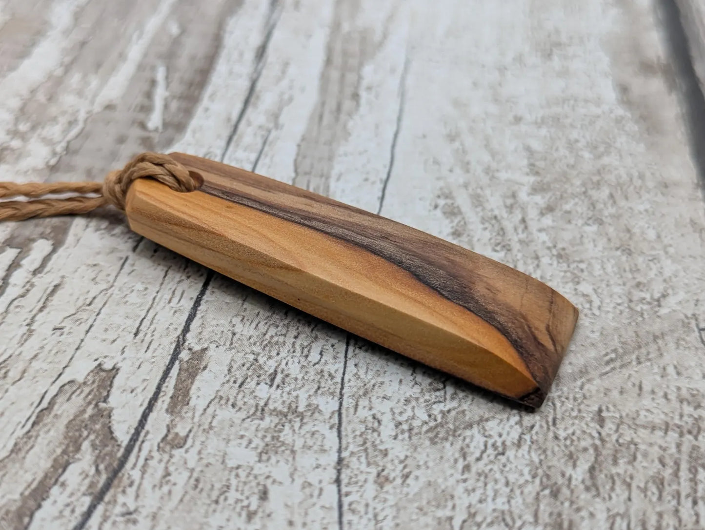 yew wood Hei toki adze style pendant - Handcrafted British jewellery, Māori inspired nature talisman, eco friendly.