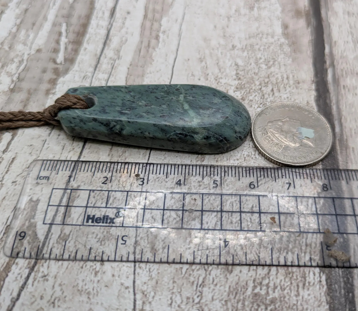 New Zealand Pounamu jade Hei Toki adze styled pendant.