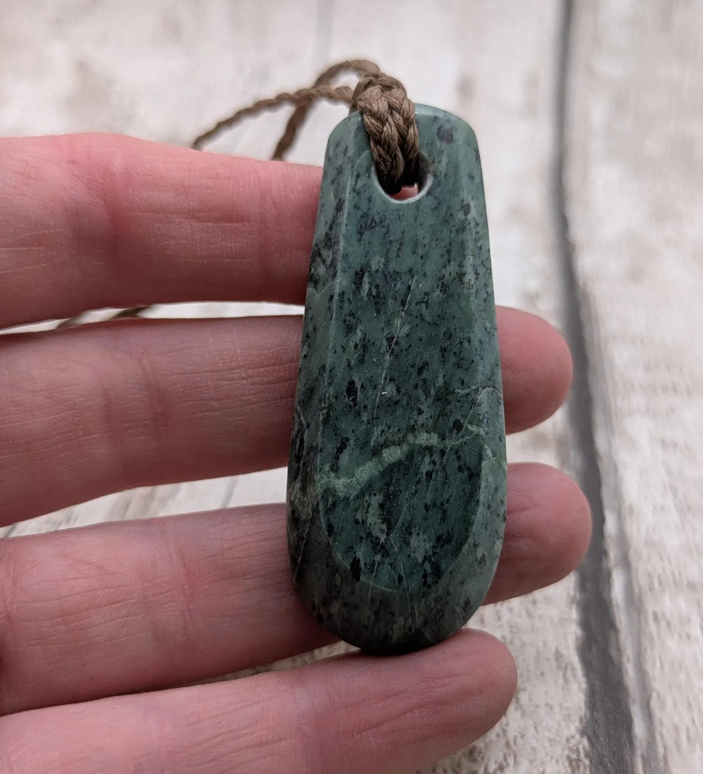 New Zealand Pounamu jade Hei Toki adze styled pendant.