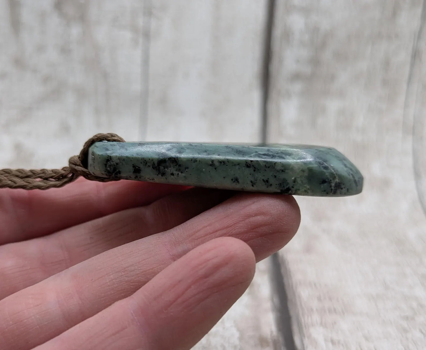 New Zealand Pounamu jade Hei Toki adze styled pendant.