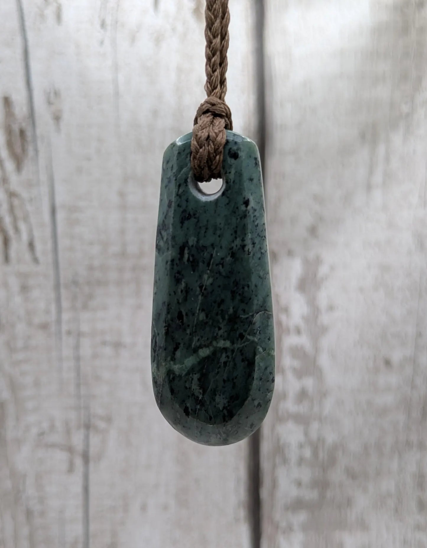 New Zealand Pounamu jade Hei Toki adze styled pendant.