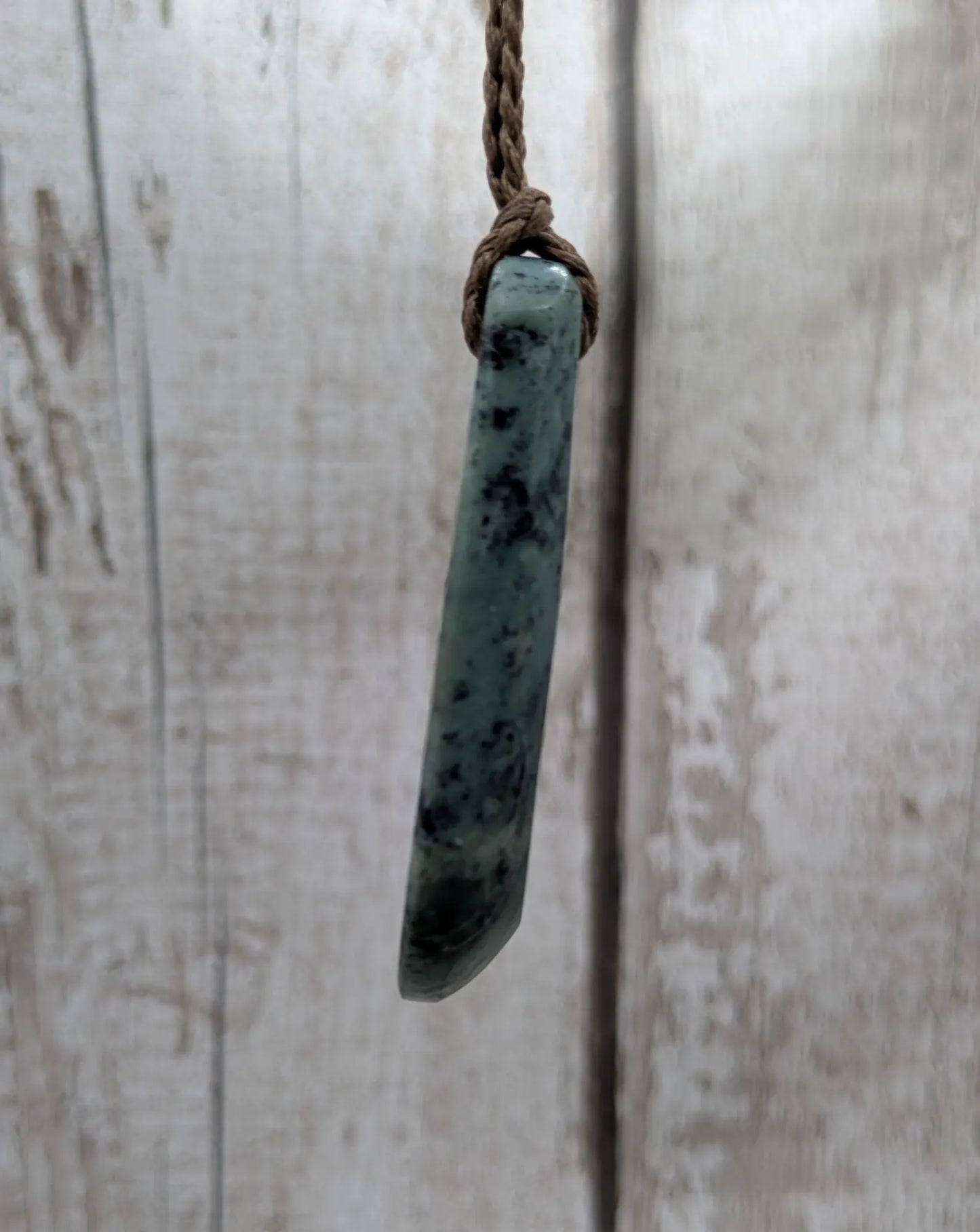 New Zealand Pounamu jade Hei Toki adze styled pendant.