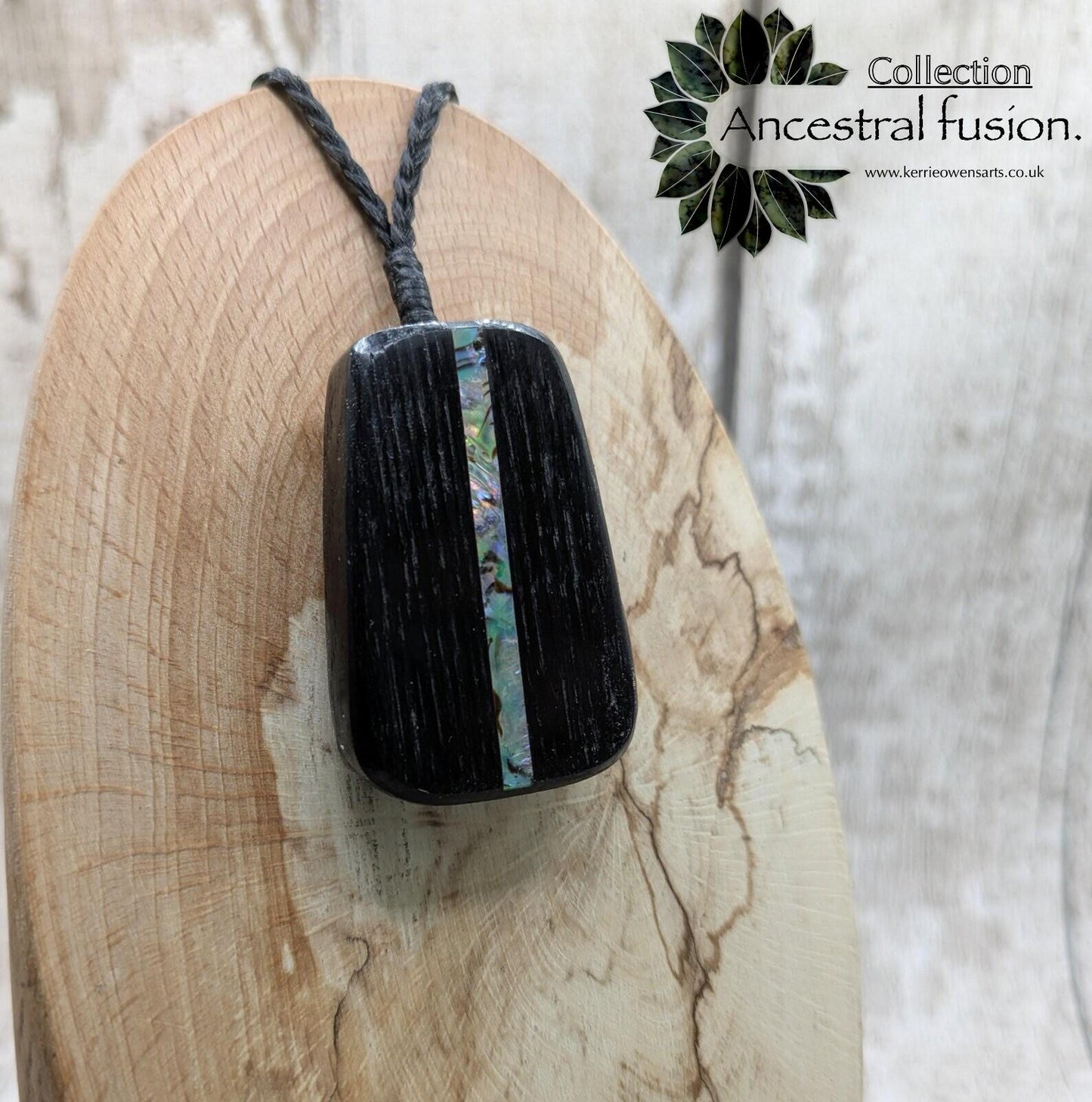 Fenland bog pendant with pāua shell inlay.