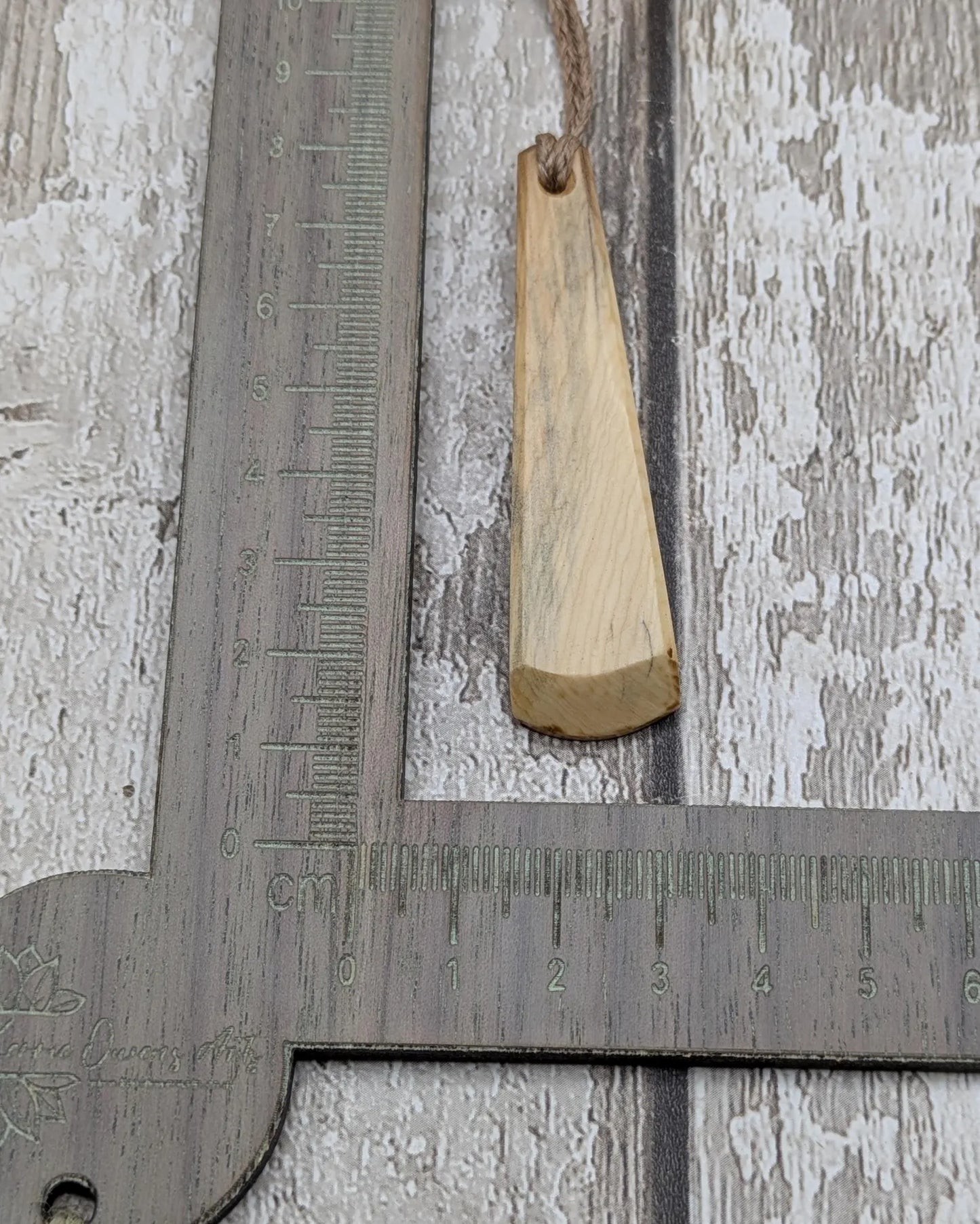 Yew wood hand crafted toki adze style pendant