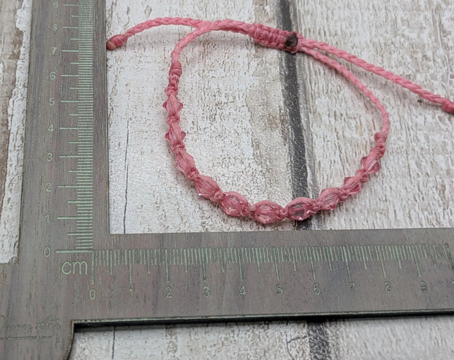 Pink faceted glass beaded macramé woven adjustable bracelet