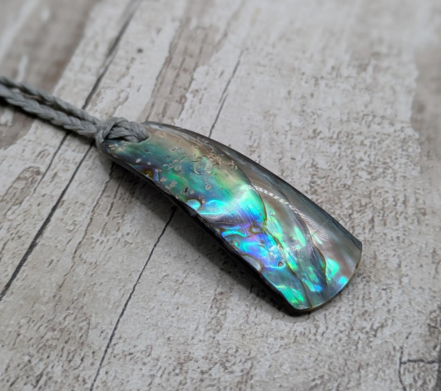 New Zealand Pāua shell pendant.