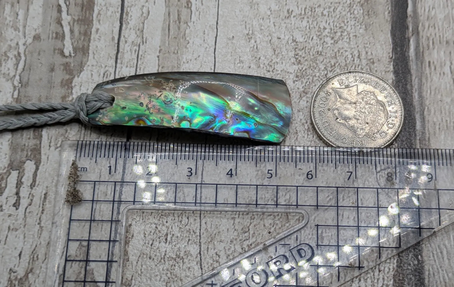 New Zealand Pāua shell pendant.