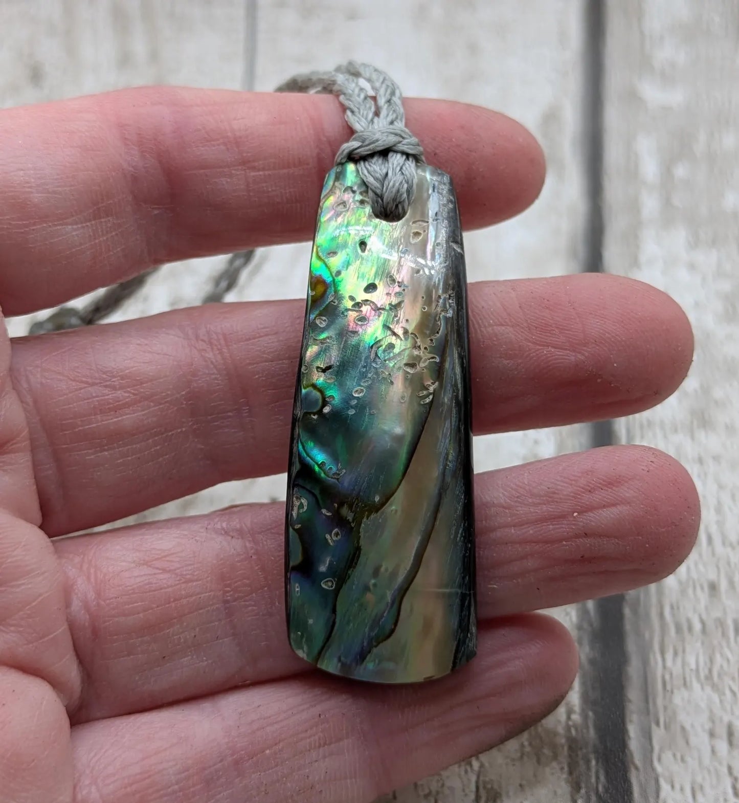 New Zealand Pāua shell pendant.