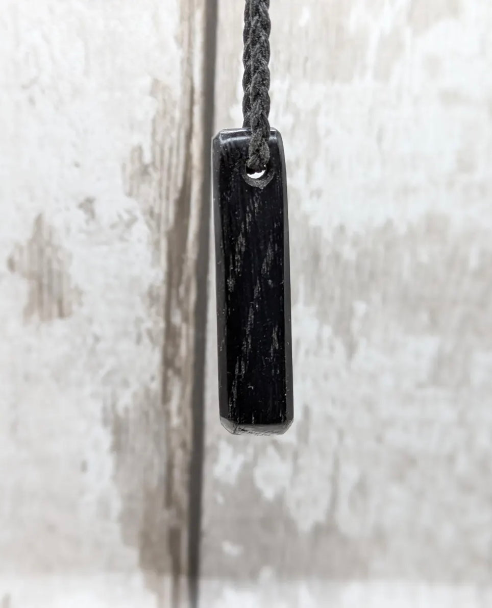 Fenland bog oak with Preseli bluestone roimata pendant.