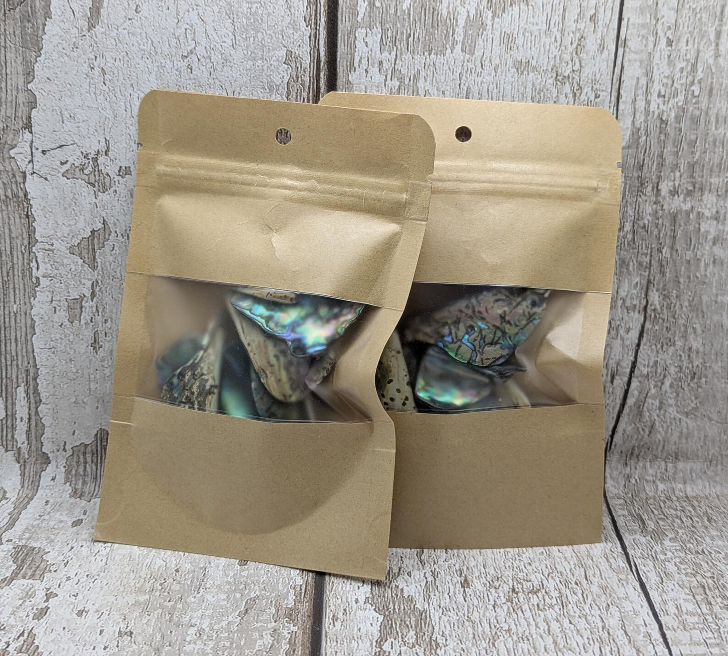 One pouch of New Zealand rainbow Pāua abalone shell odd shapes.