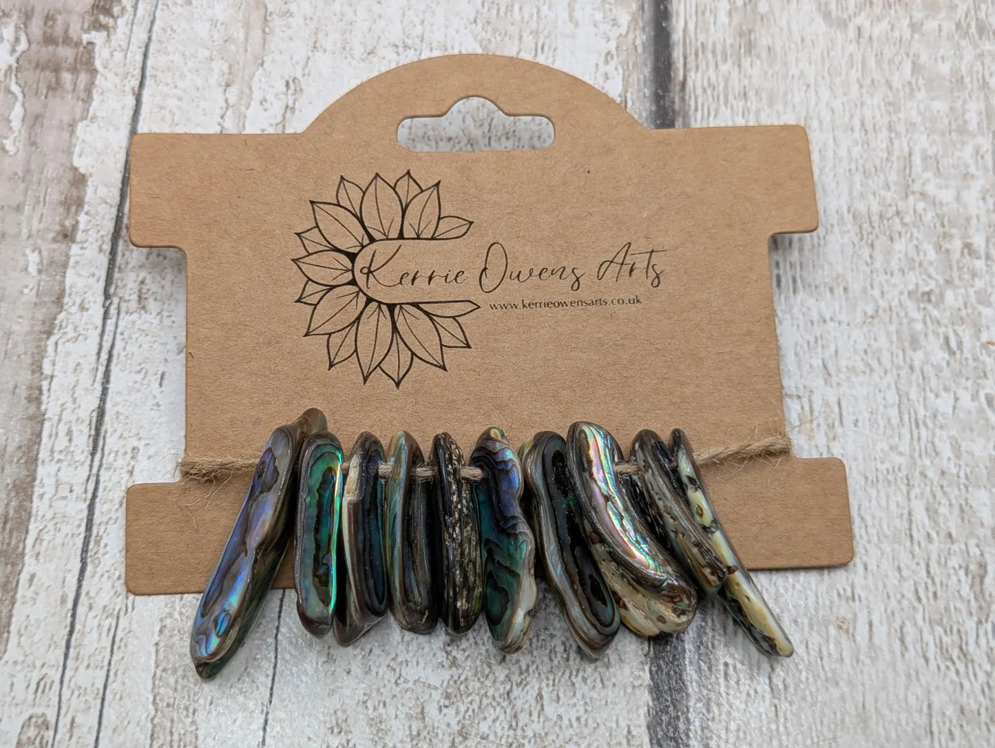 20 central drilled new Zealand rainbow pāua abalone shell beads.