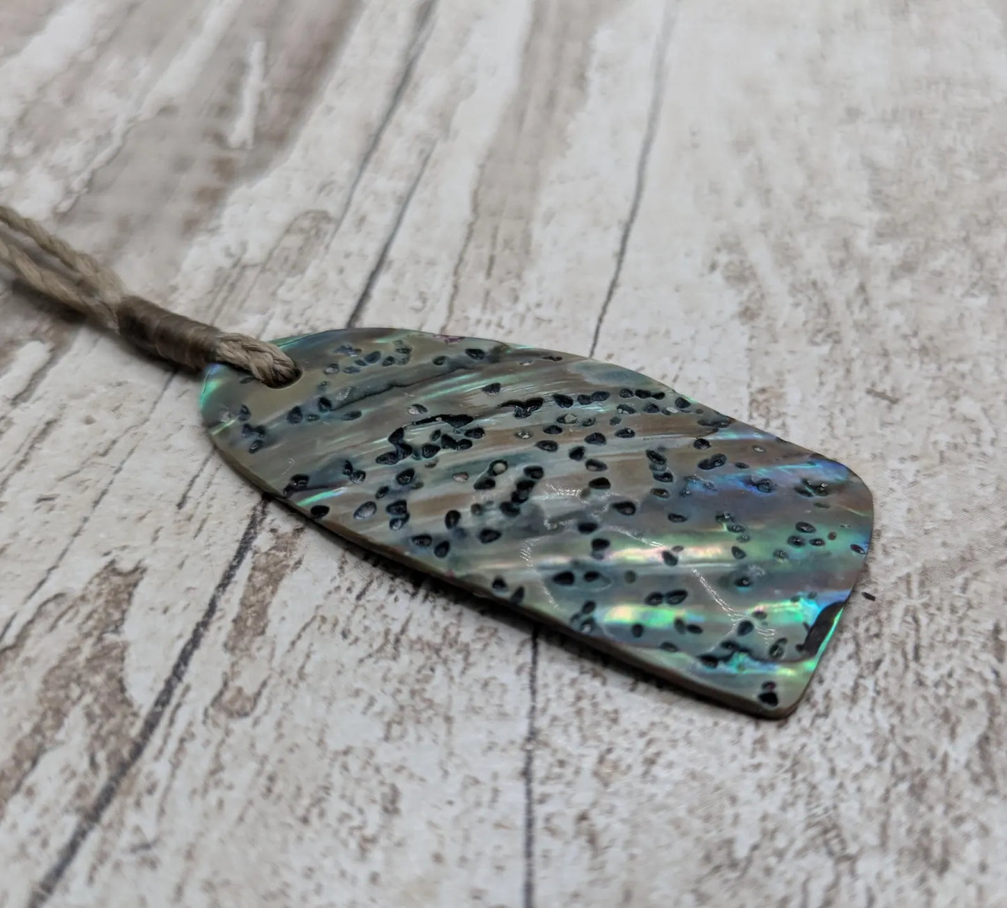 New Zealand Rainbow pāua shell pendant - iridescent abalone necklace, trapezoid shape, oceanic gift, hand crafted jewellery.