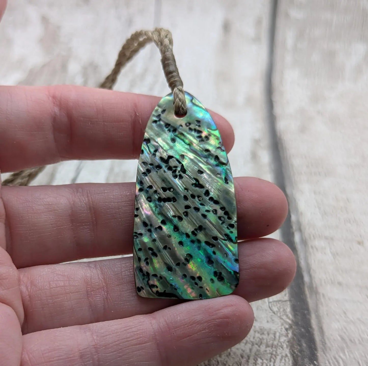 New Zealand Rainbow pāua shell pendant - iridescent abalone necklace, trapezoid shape, oceanic gift, hand crafted jewellery.