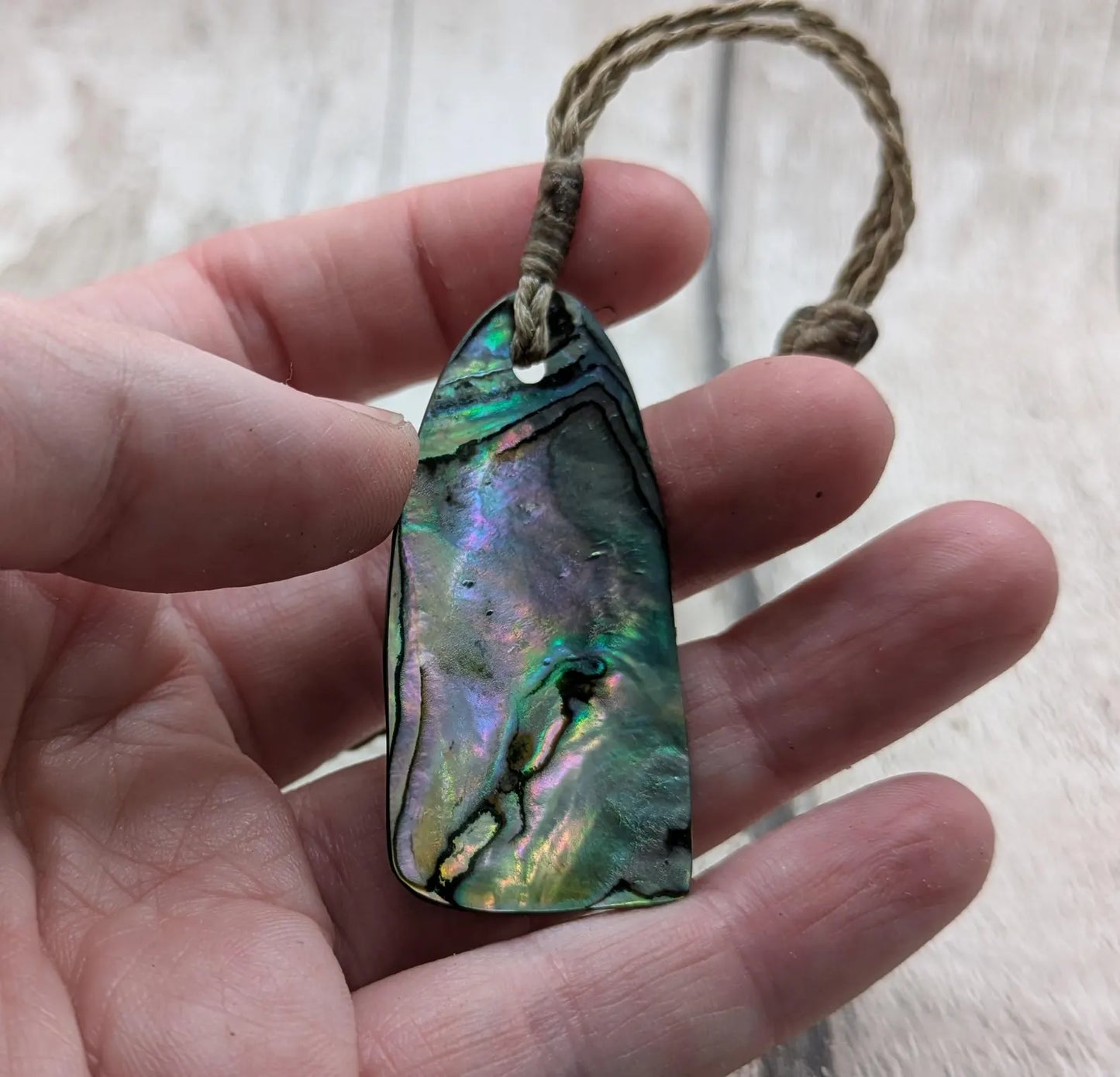 New Zealand Rainbow pāua shell pendant - iridescent abalone necklace, trapezoid shape, oceanic gift, hand crafted jewellery.