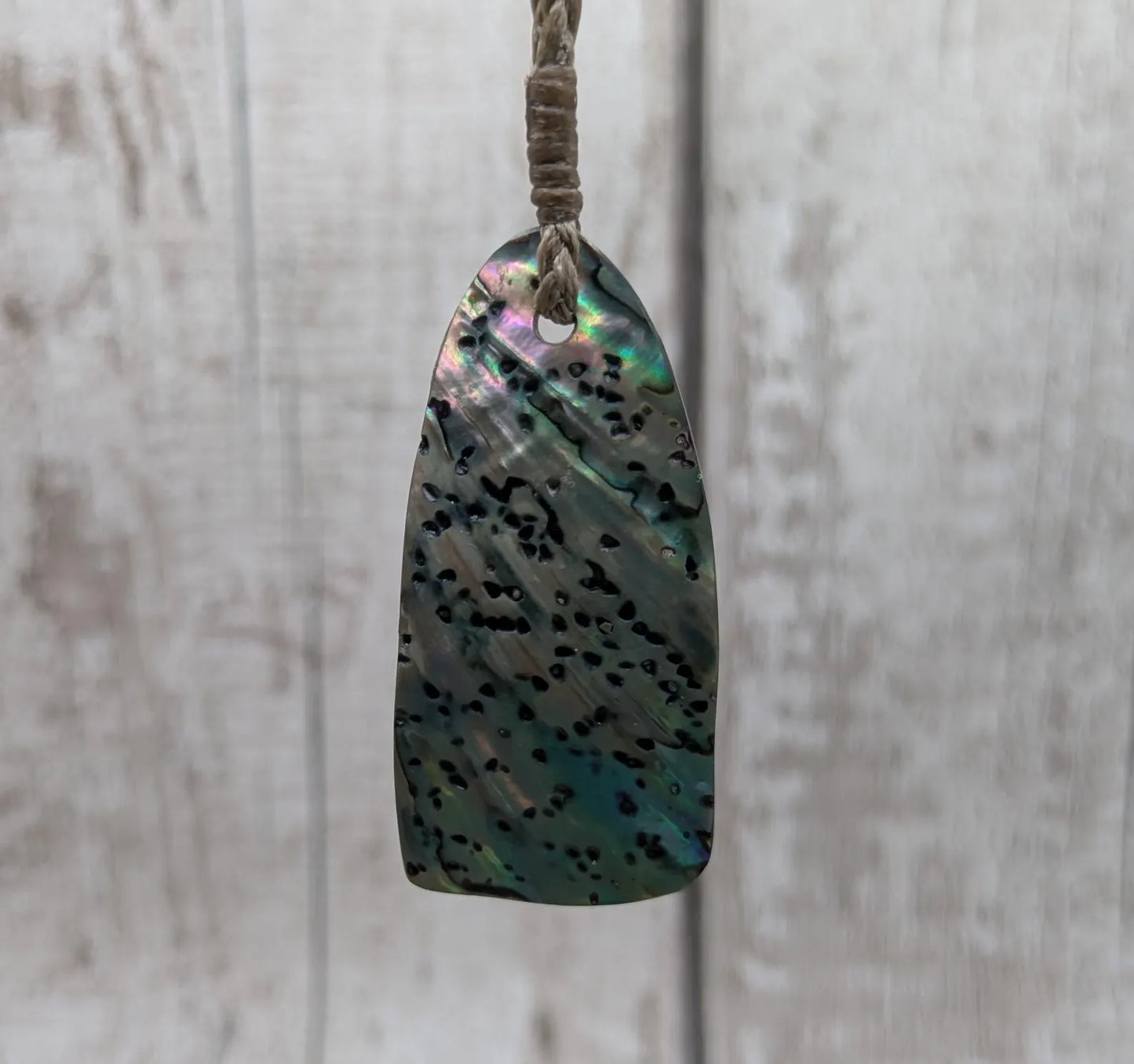 New Zealand Rainbow pāua shell pendant - iridescent abalone necklace, trapezoid shape, oceanic gift, hand crafted jewellery.