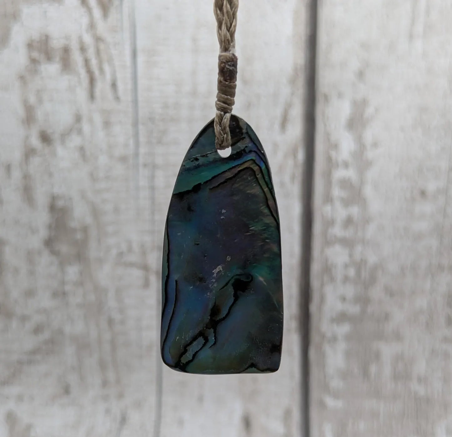 New Zealand Rainbow pāua shell pendant - iridescent abalone necklace, trapezoid shape, oceanic gift, hand crafted jewellery.