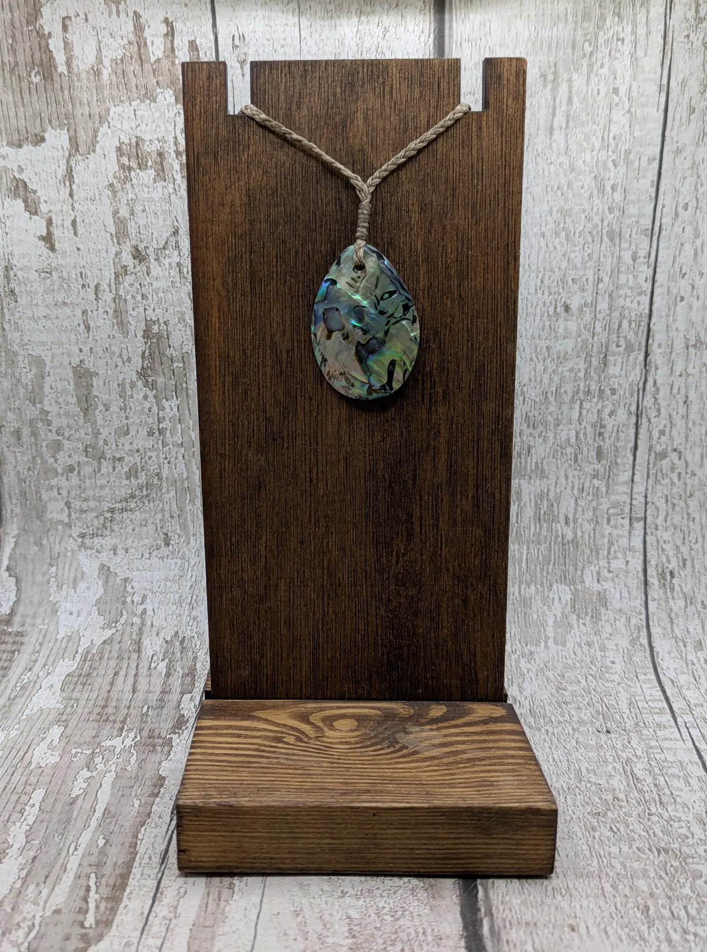 Carved NZ Pāua Shell Oval Pendant – Handcrafted Rainbow Abalone Jewel, Ocean-Inspired fashion, iridescent amulet.