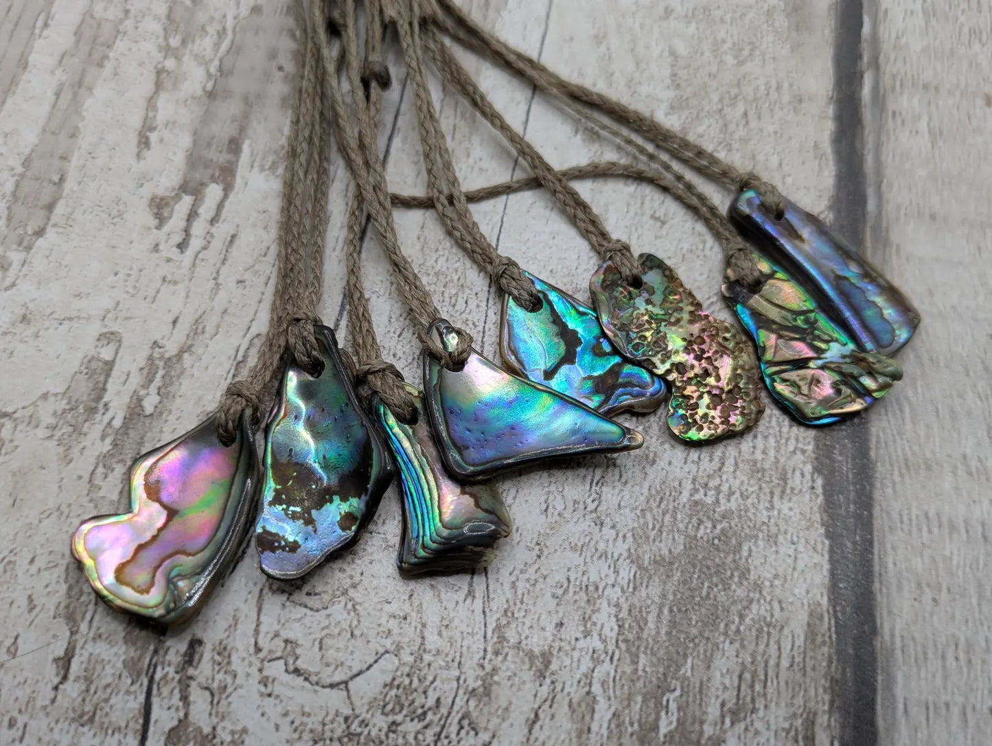 New Zealand rainbow paua abalone shell tumbled offcut unisex pendant.