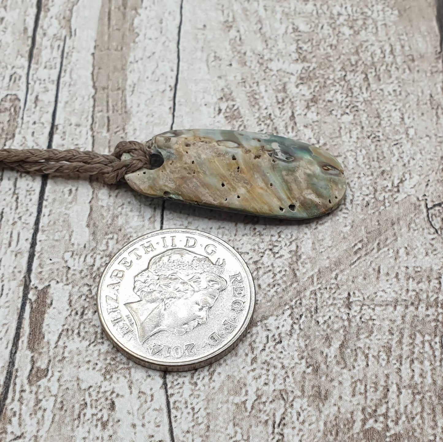 New Zealand rainbow paua abalone shell tumbled offcut unisex pendant.