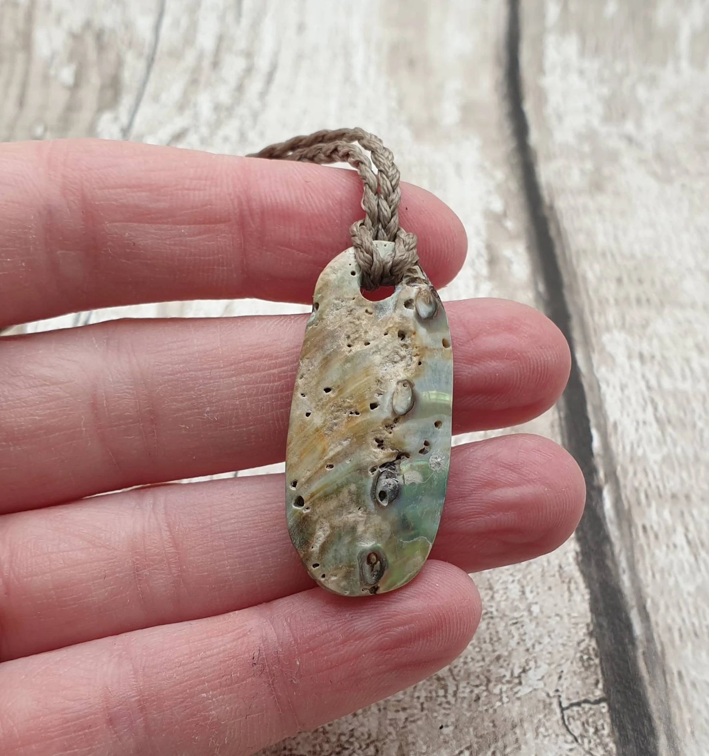 New Zealand rainbow paua abalone shell tumbled offcut unisex pendant.