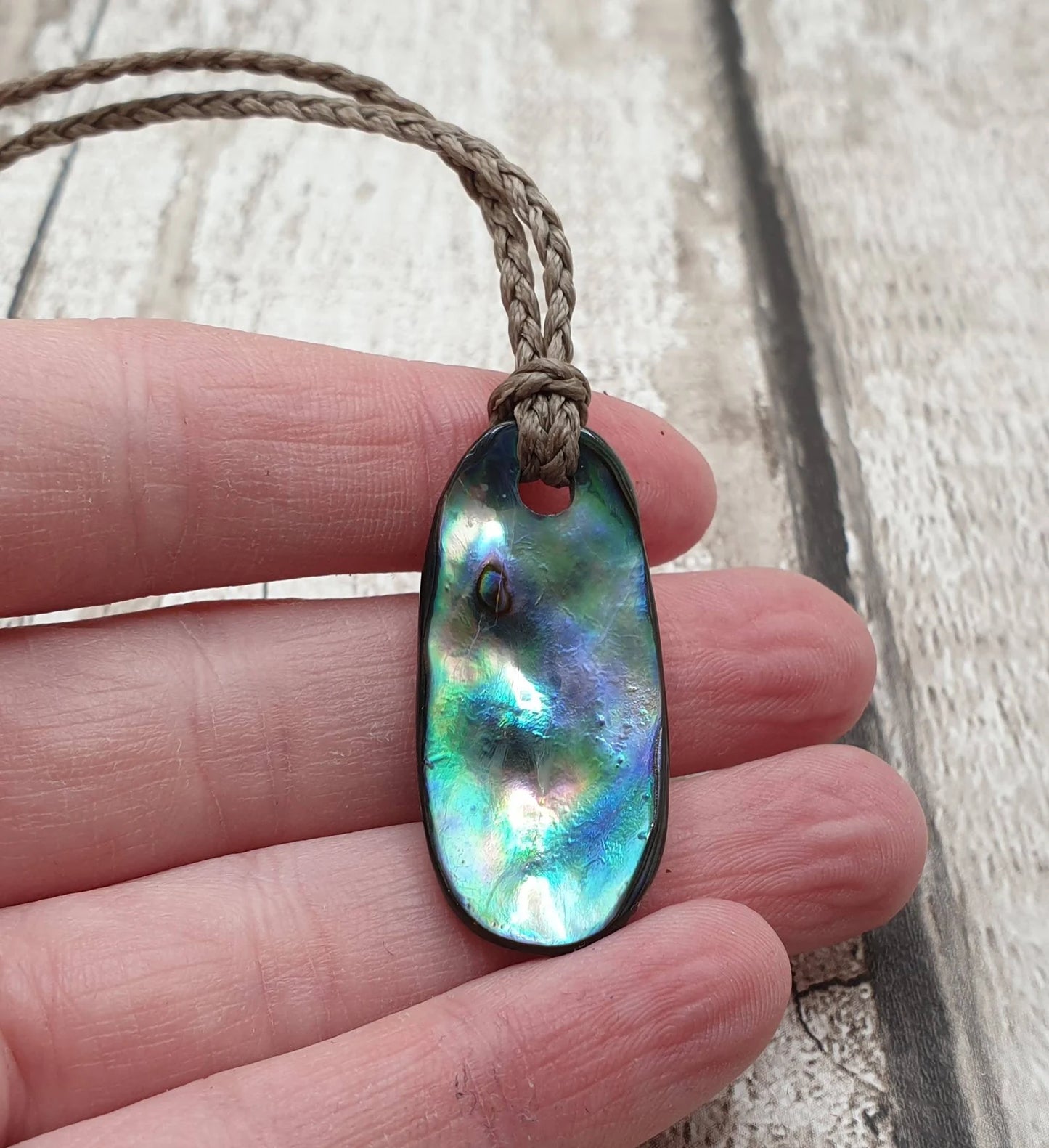 New Zealand rainbow paua abalone shell tumbled offcut unisex pendant.