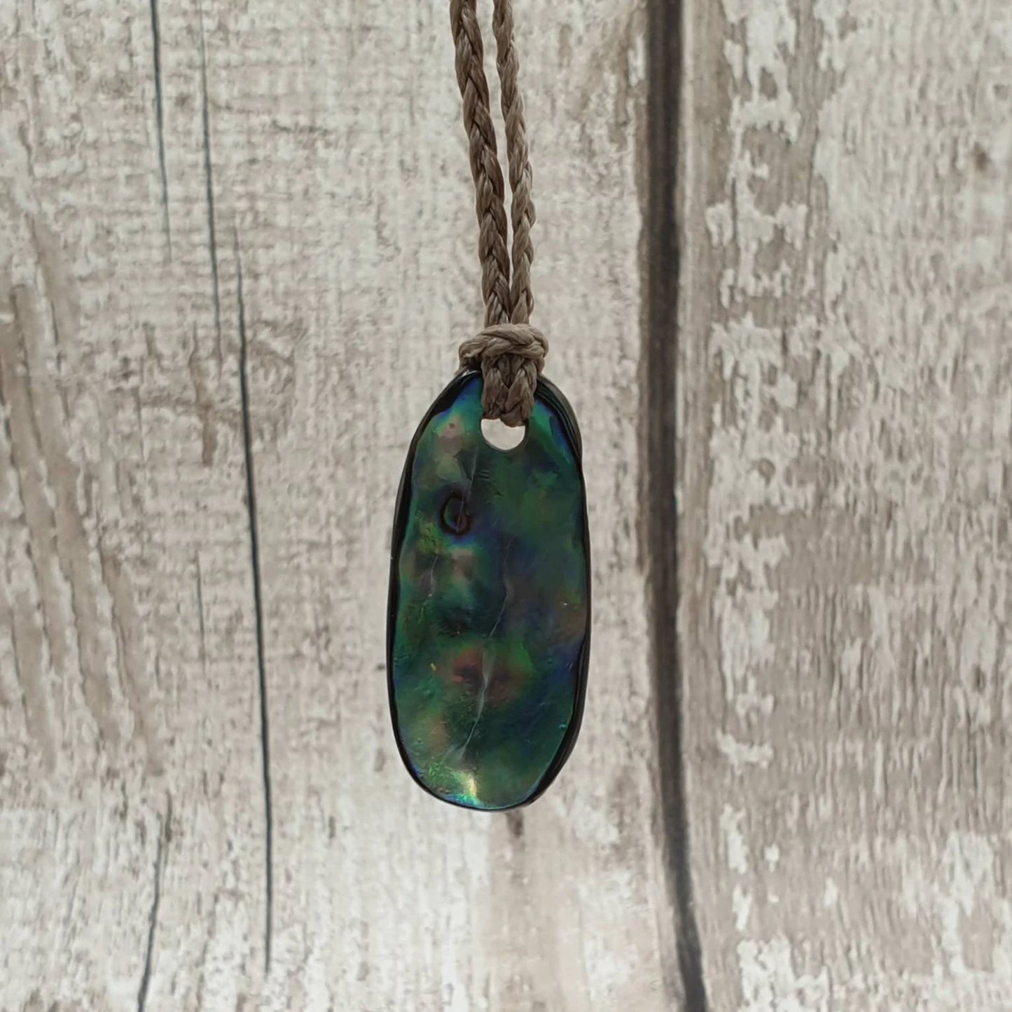 New Zealand rainbow paua abalone shell tumbled offcut unisex pendant.