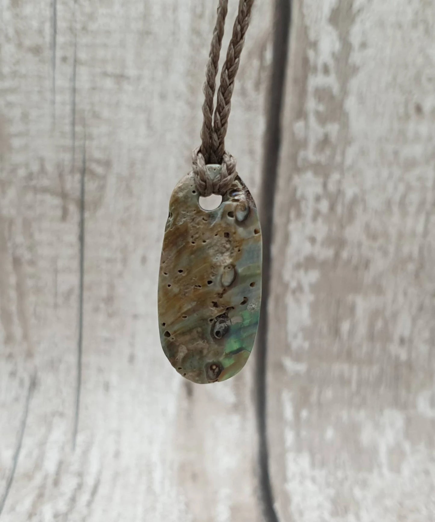 New Zealand rainbow paua abalone shell tumbled offcut unisex pendant.