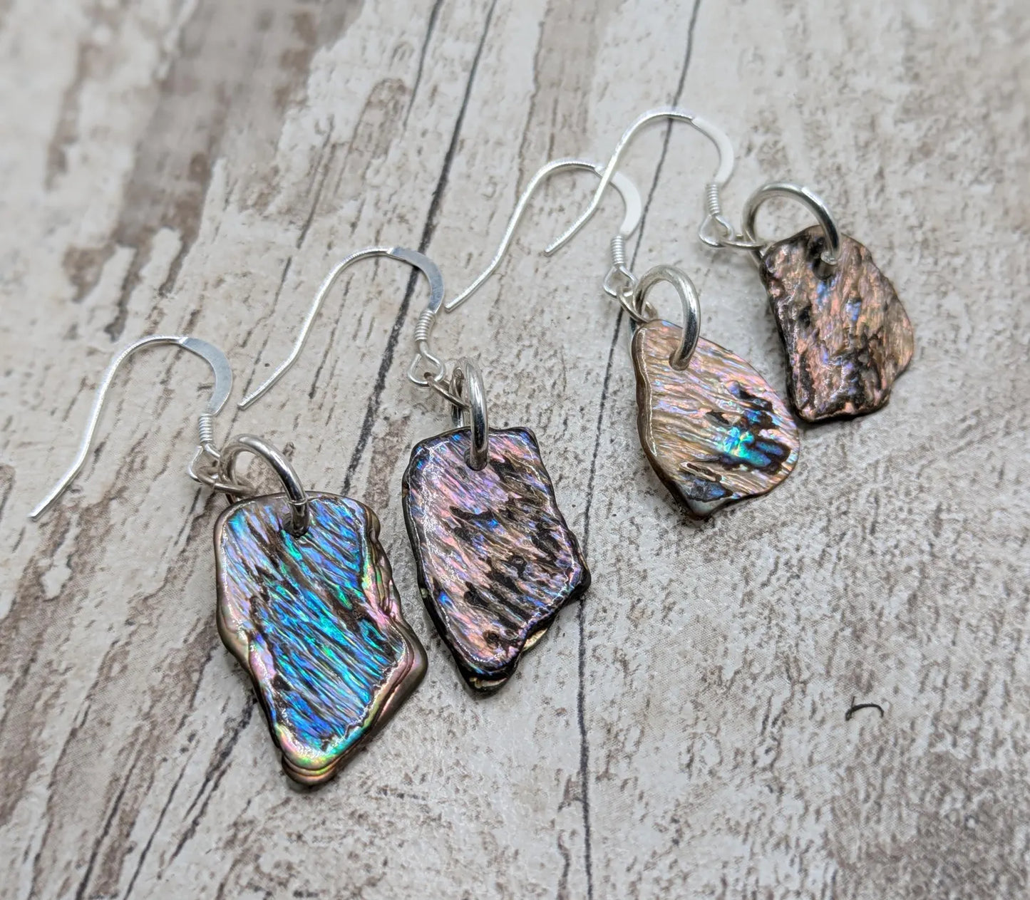 New Zealand Pāua Shell Earrings – Rainbow Abalone Free-Form Drops on Sterling Silver Hooks | Ocean Energy Jewellery.