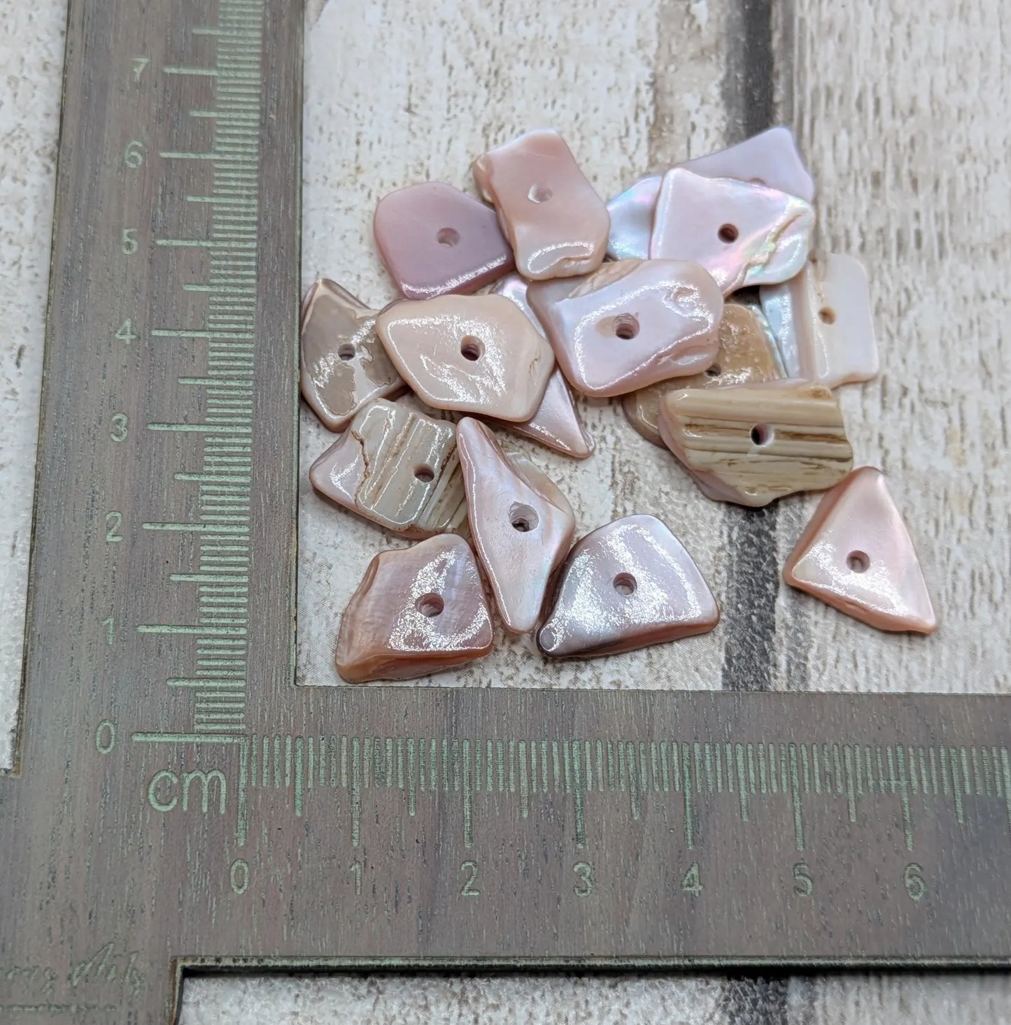 20 centre drilled New Zealand pink fresh water mussel beads.