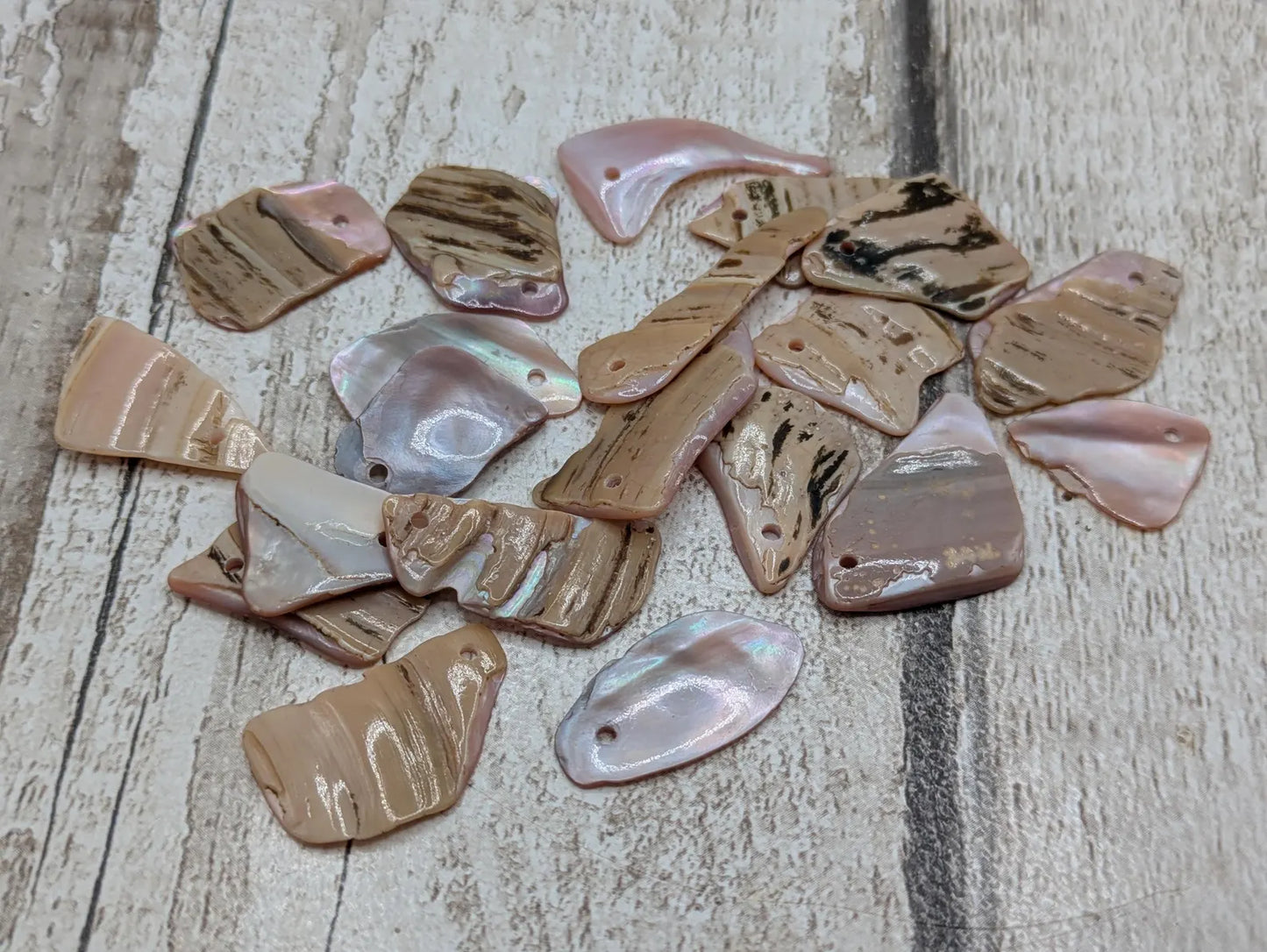 20 top drilled New Zealand pink mussel shell beads.
