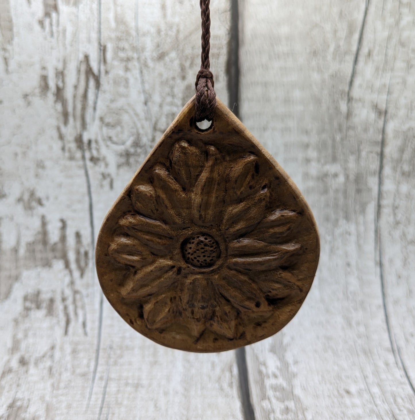 Birch wood sunflower medallion pendant.