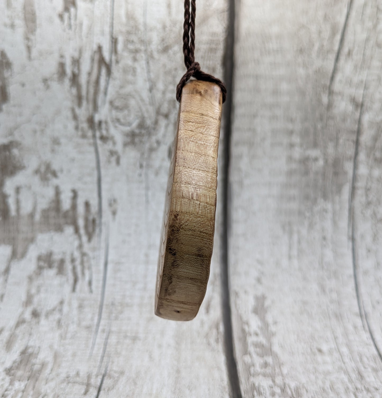Birch wood sunflower medallion pendant.