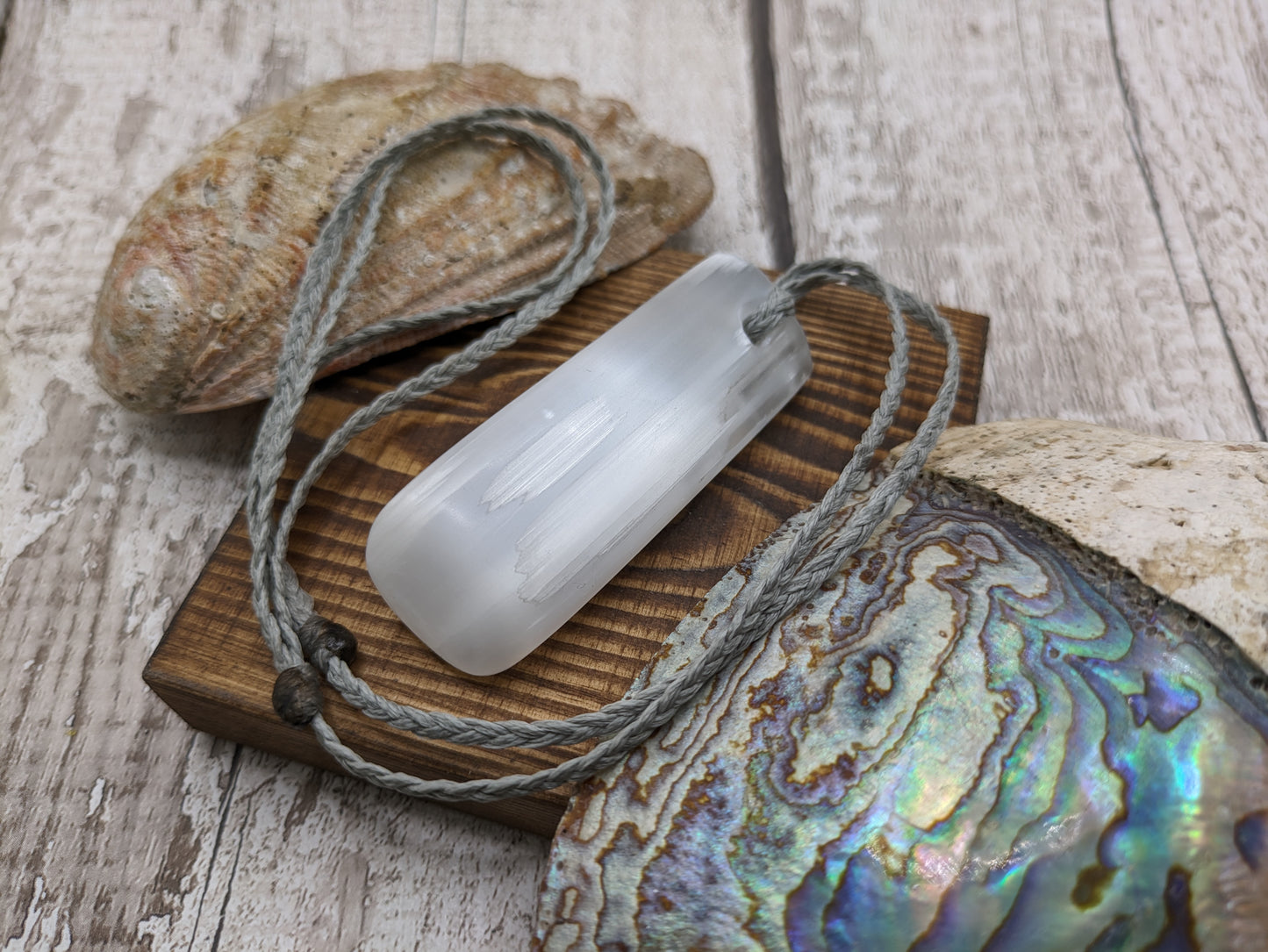 Selenite satin spar toki style pendant.