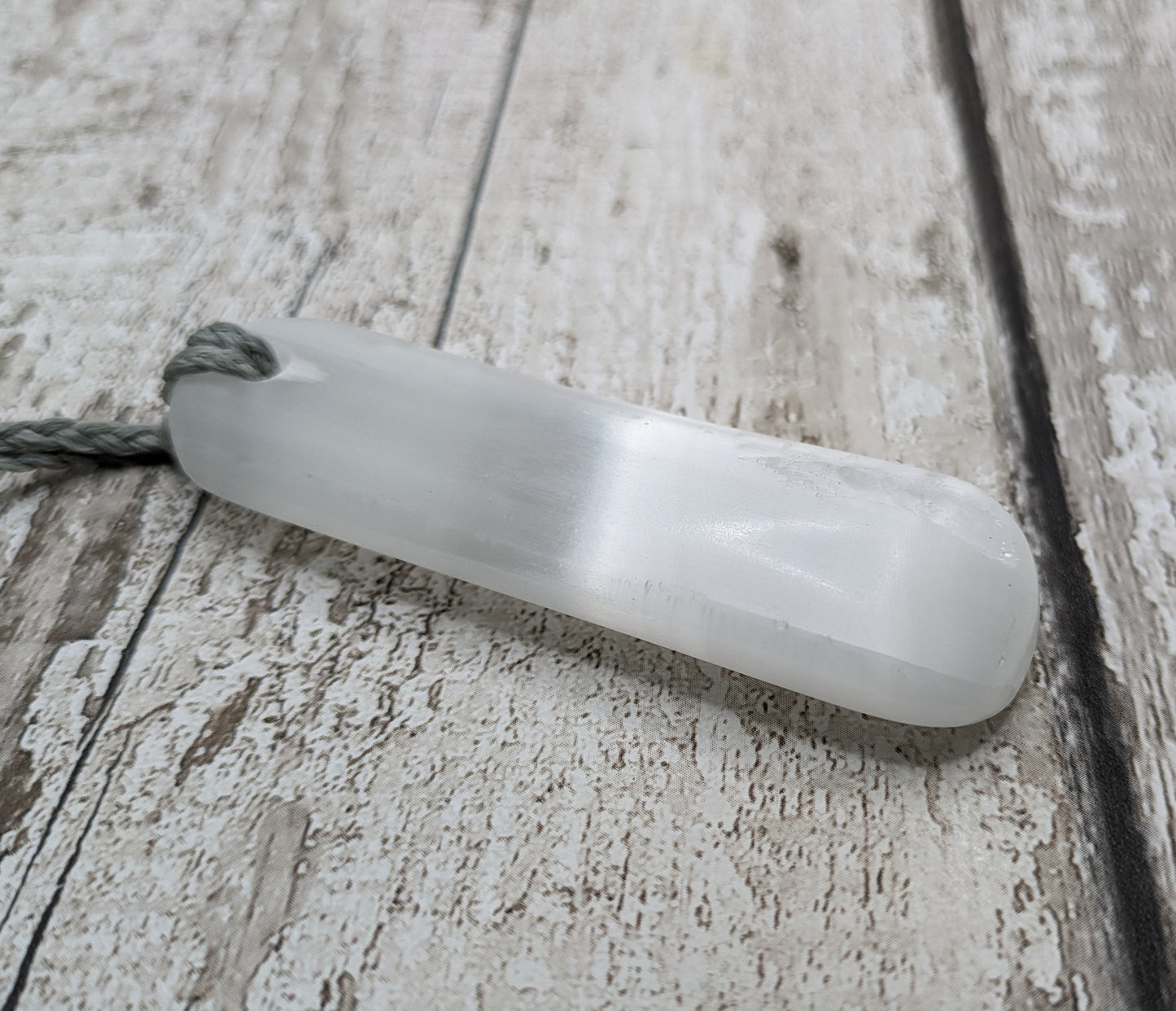 Selenite satin spar toki inspired pendant.