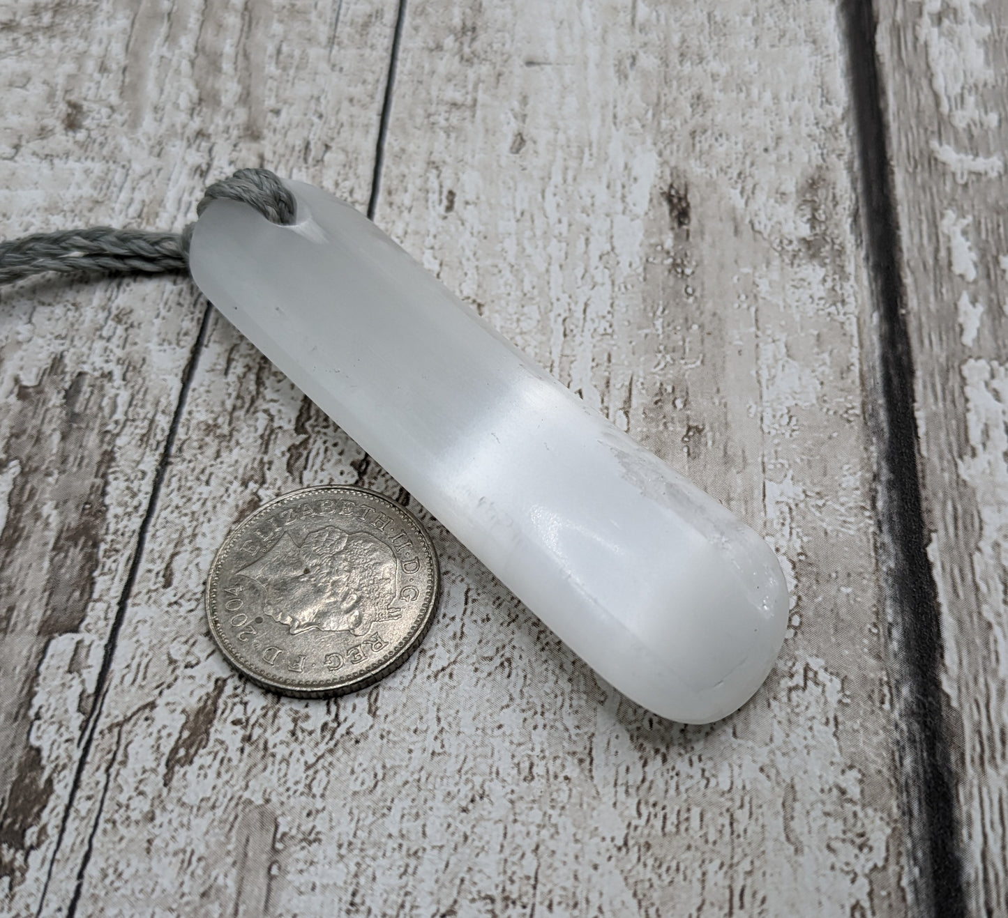 Selenite satin spar toki inspired pendant.