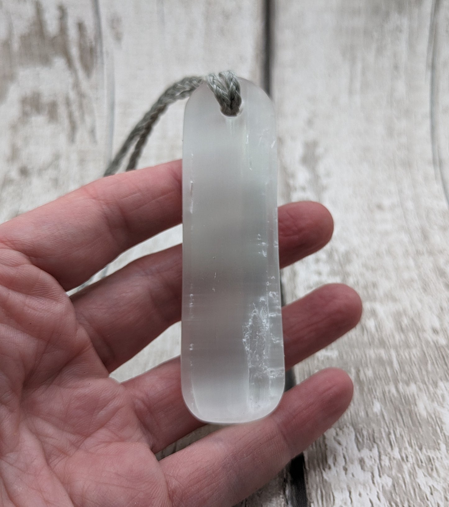 Selenite satin spar toki inspired pendant.