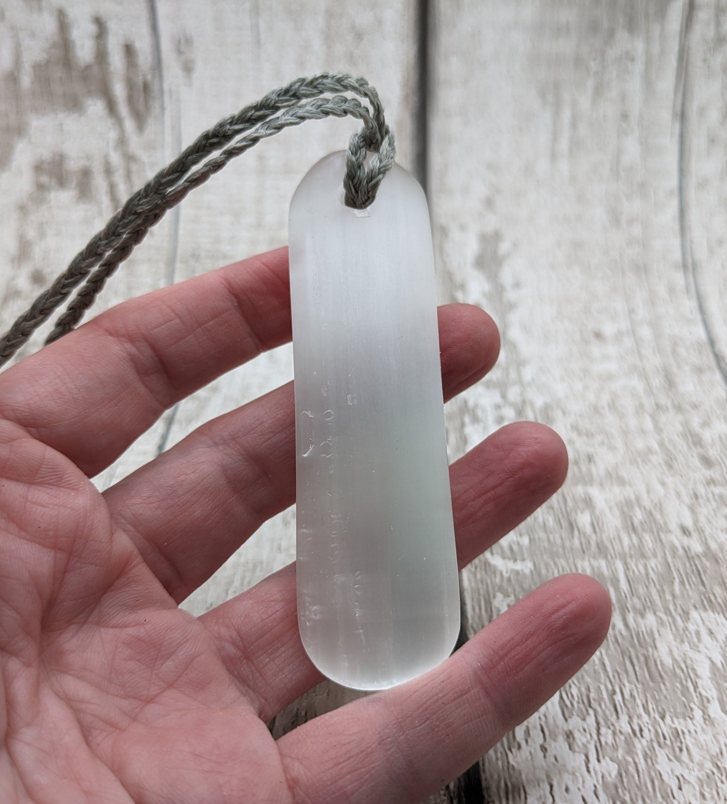 Selenite satin spar toki inspired pendant.
