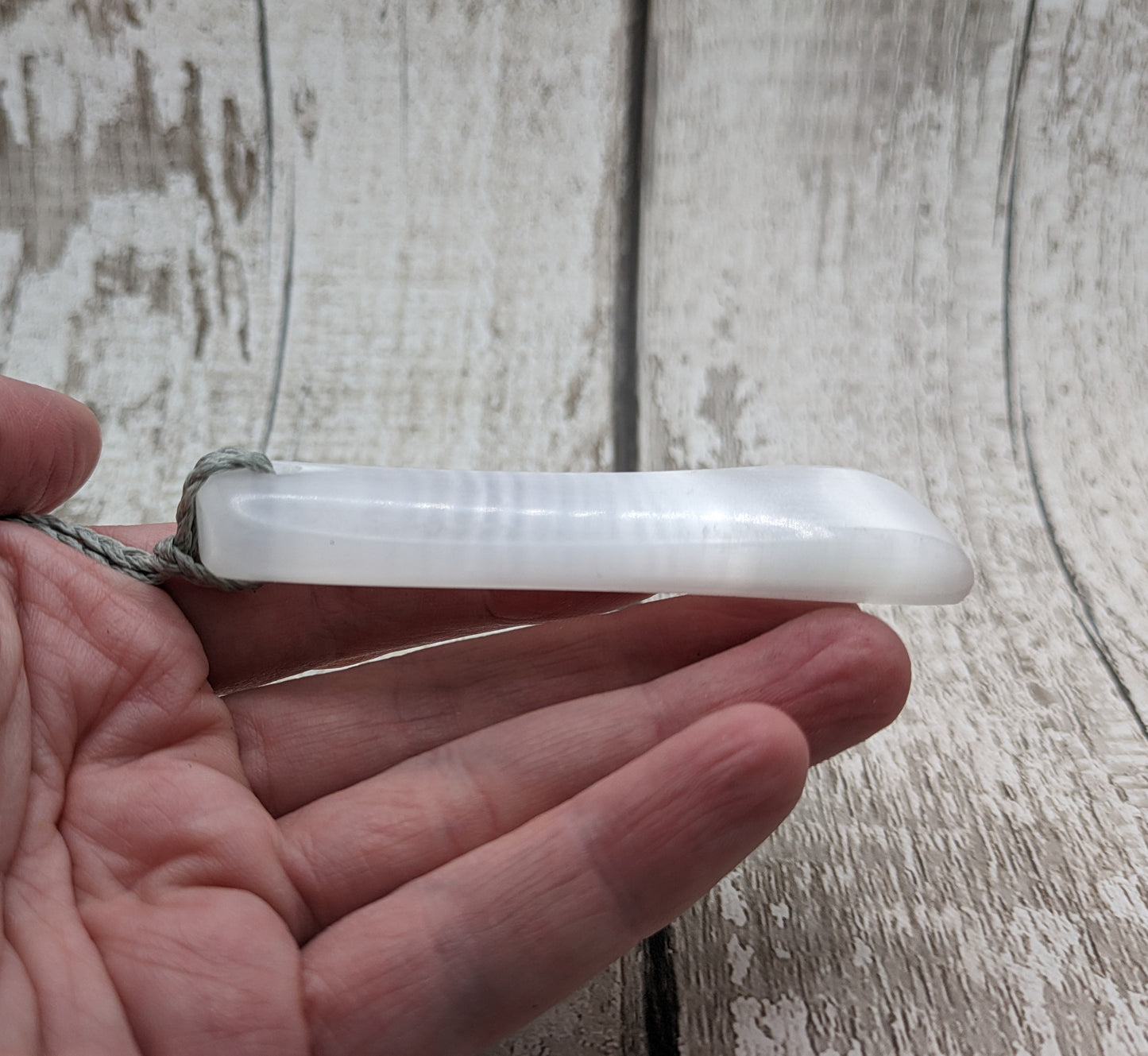 Selenite satin spar toki inspired pendant.
