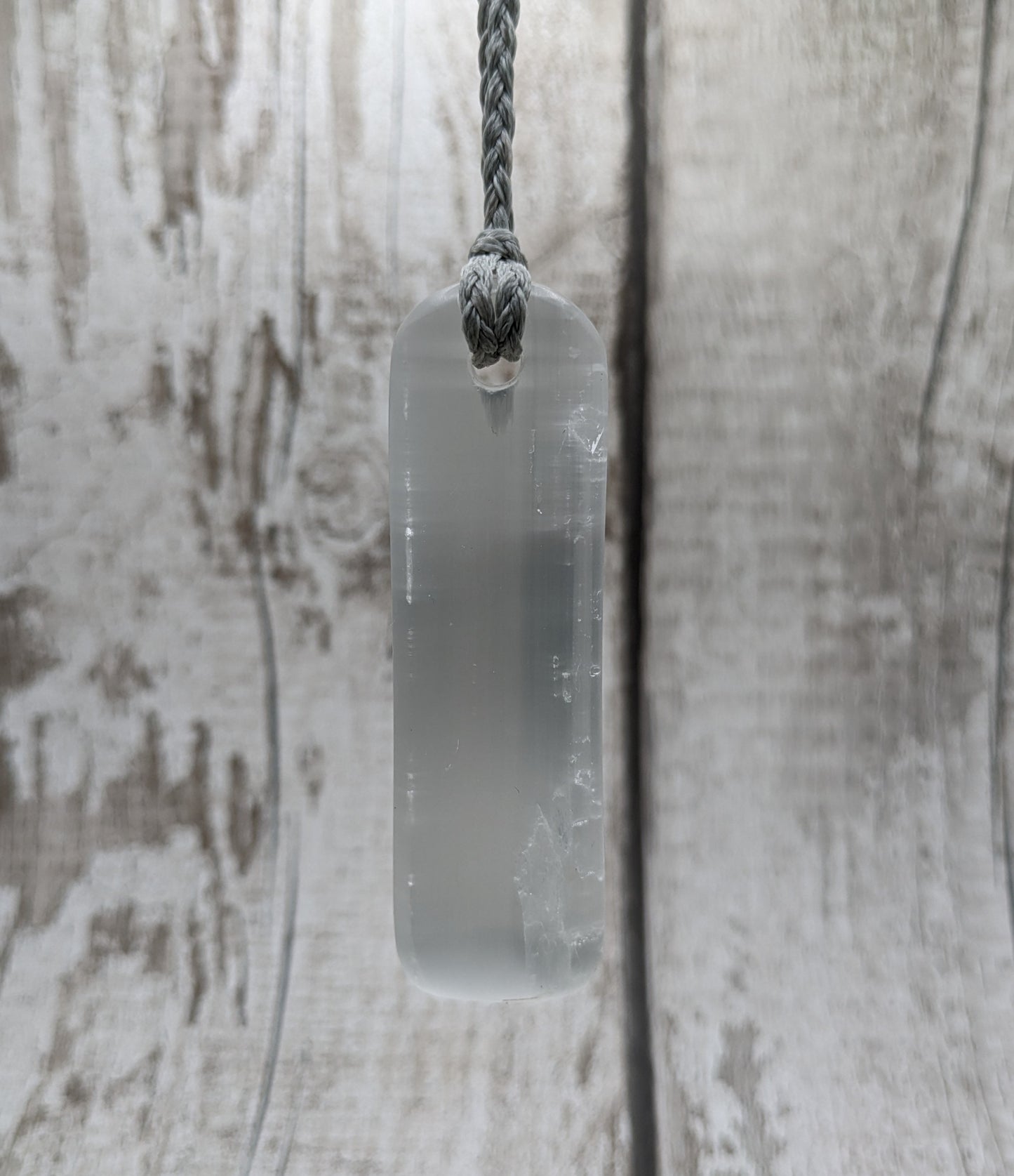 Selenite satin spar toki inspired pendant.