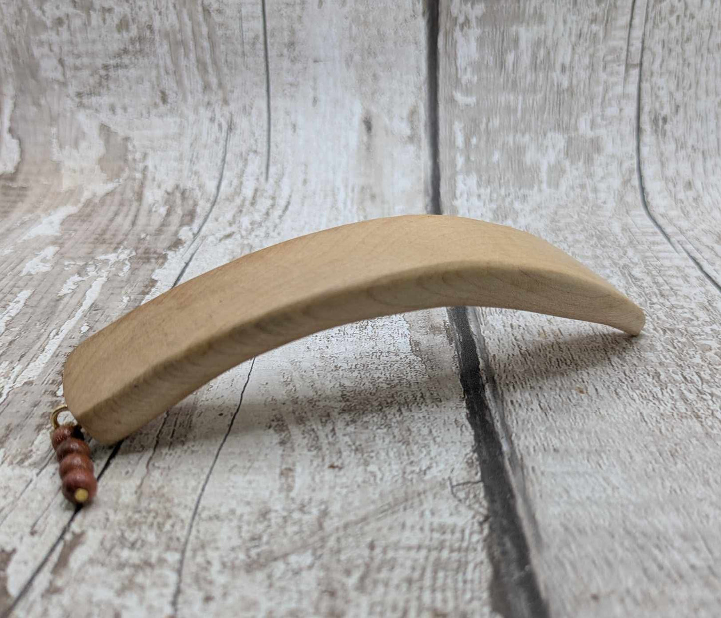 Ash wood carved hair stick with goldstone charm.