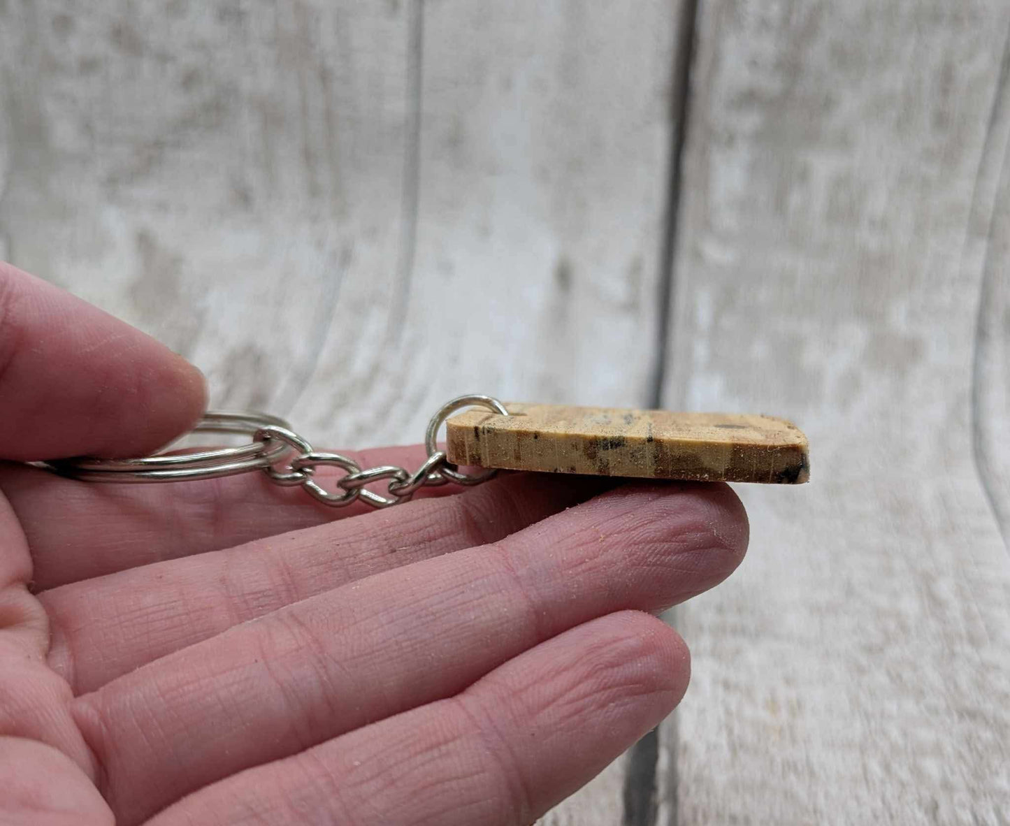 Beech wood keyring with blue kyanite inlay.