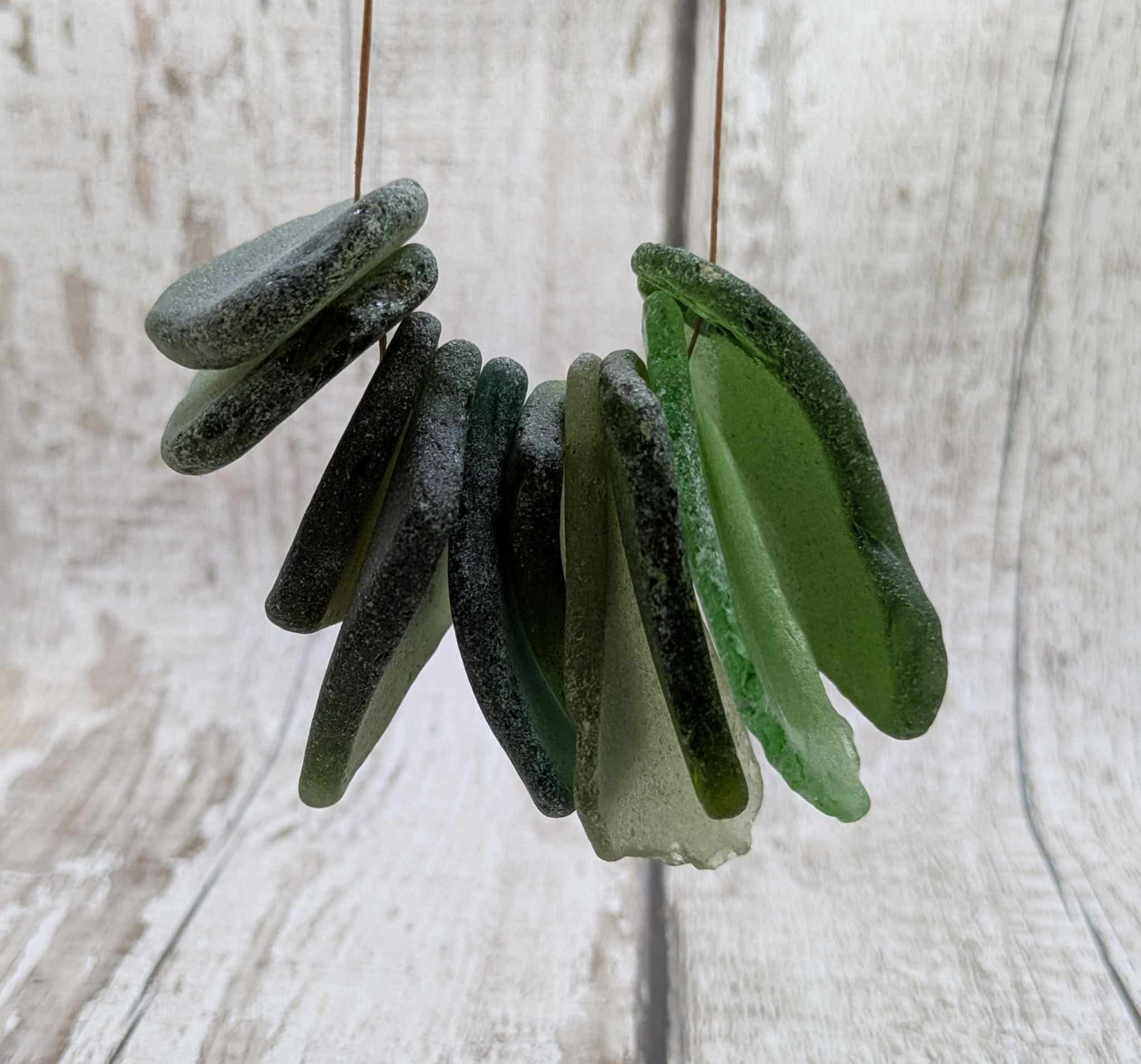 Green sea glass top drilled beads.