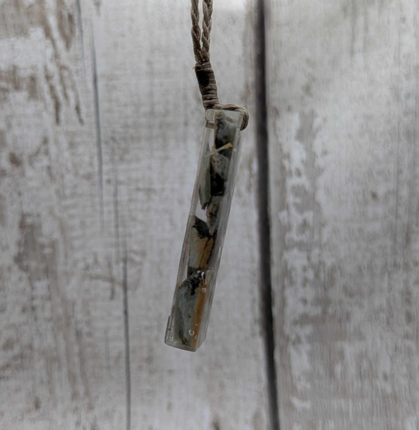 New Zealand Pounamu greenstone chip pendant in Uv resin casting.